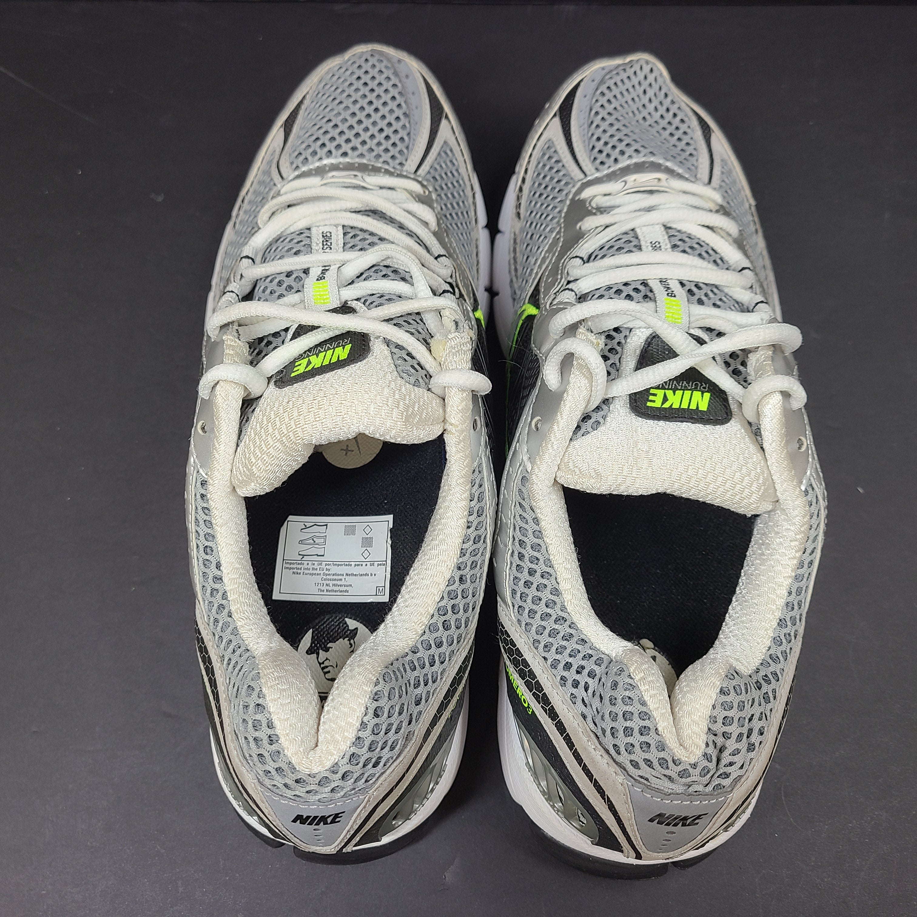 Gray and green Nike Zoom Vomero 3 running shoes in US size 11 designed for responsive comfort and stability.
