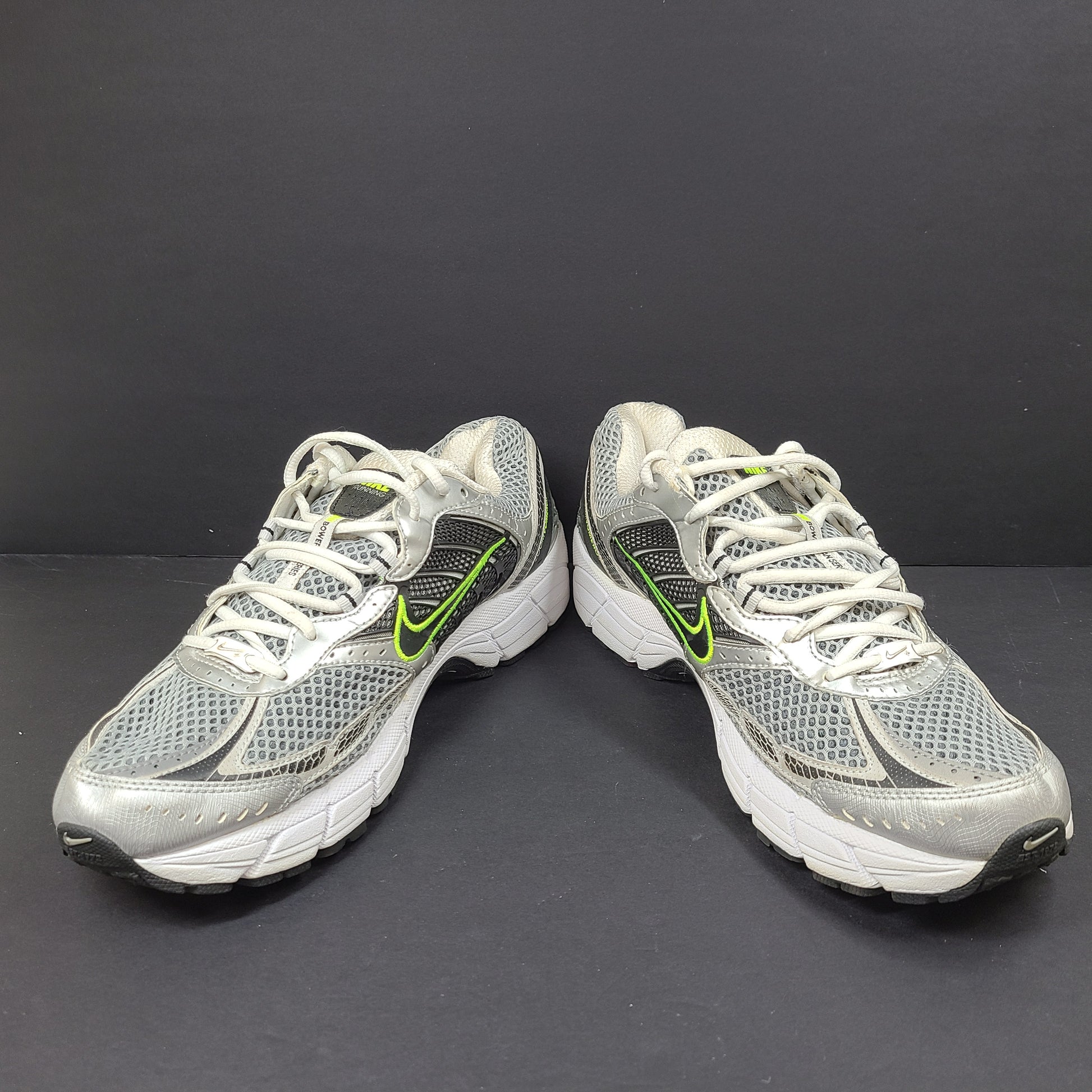 Gray and green Nike Zoom Vomero 3 running shoes in US size 11 designed for responsive comfort and stability.