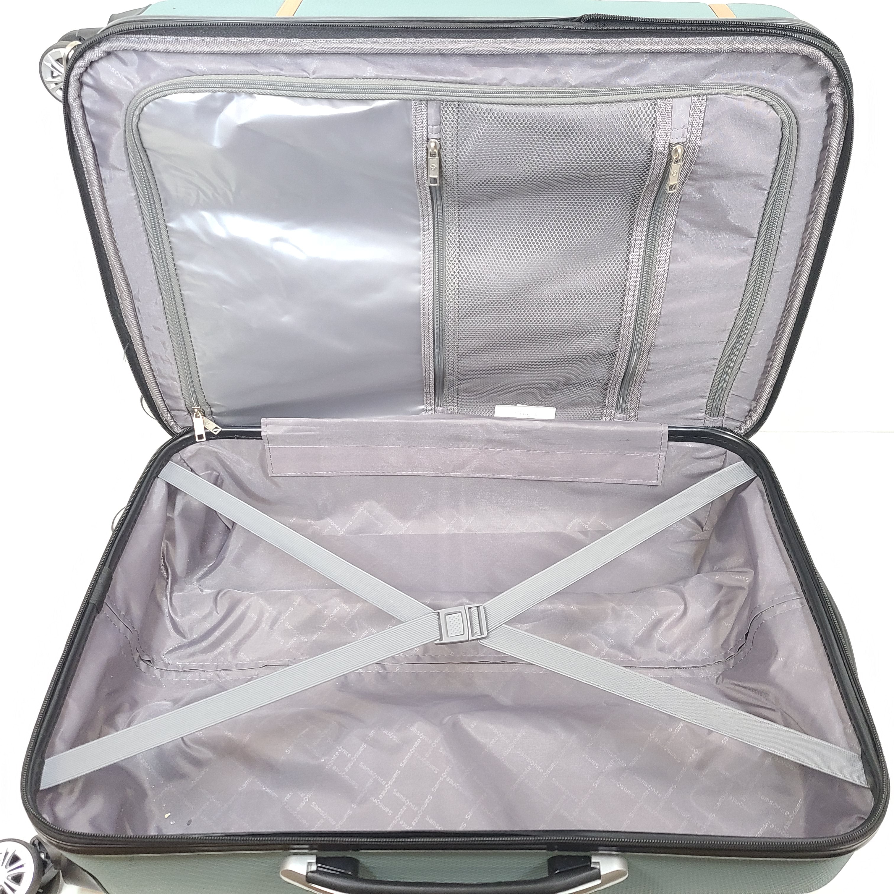 A light blue Samsonite medium suitcase with yellow accents and a front Samsonite logo.