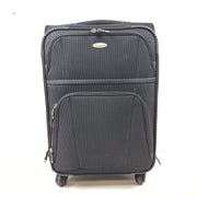 Black Samsonite suitcase QC-002454 with minor scuff marks and labeled material composition.
