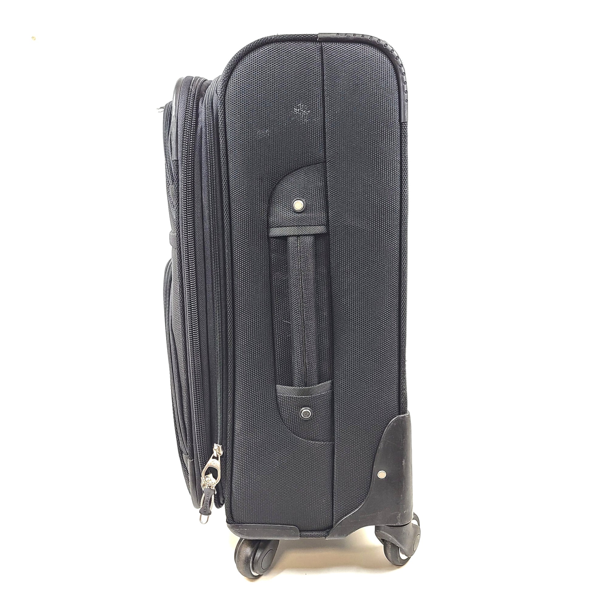 Black Samsonite suitcase QC-002454 with minor scuff marks and labeled material composition.