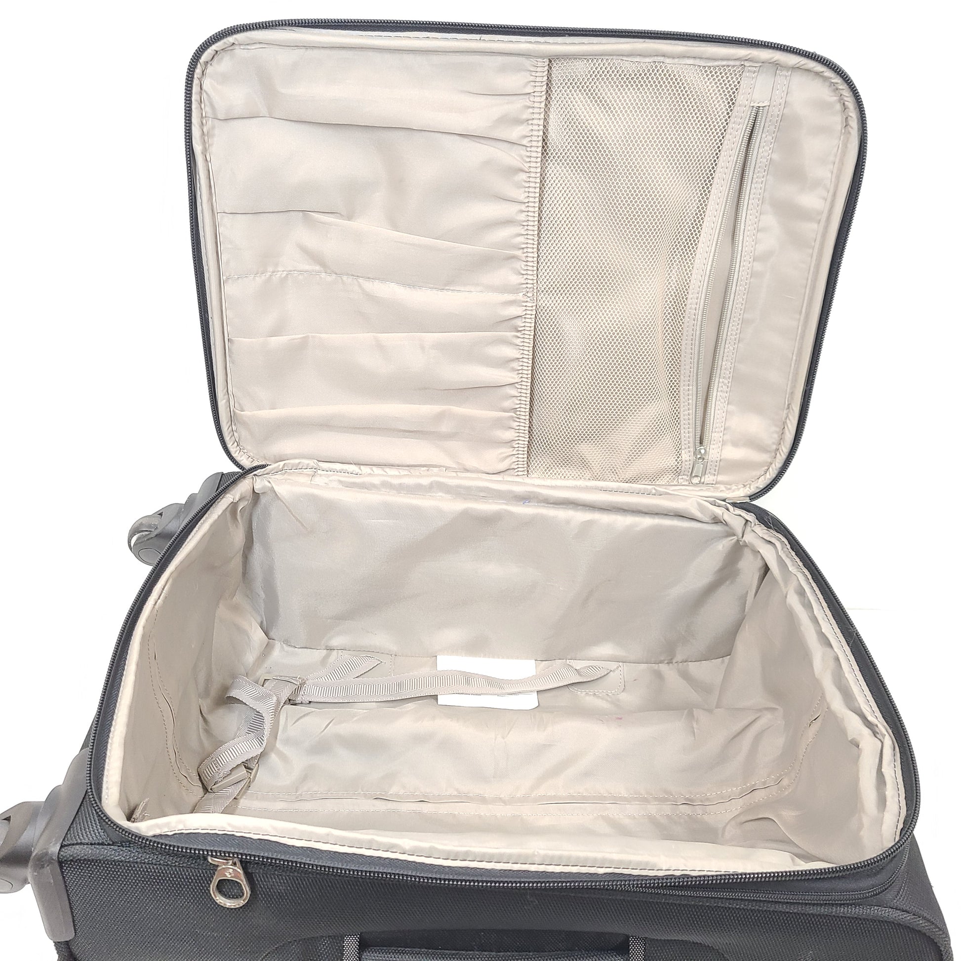 Black Samsonite suitcase QC-002454 with minor scuff marks and labeled material composition.