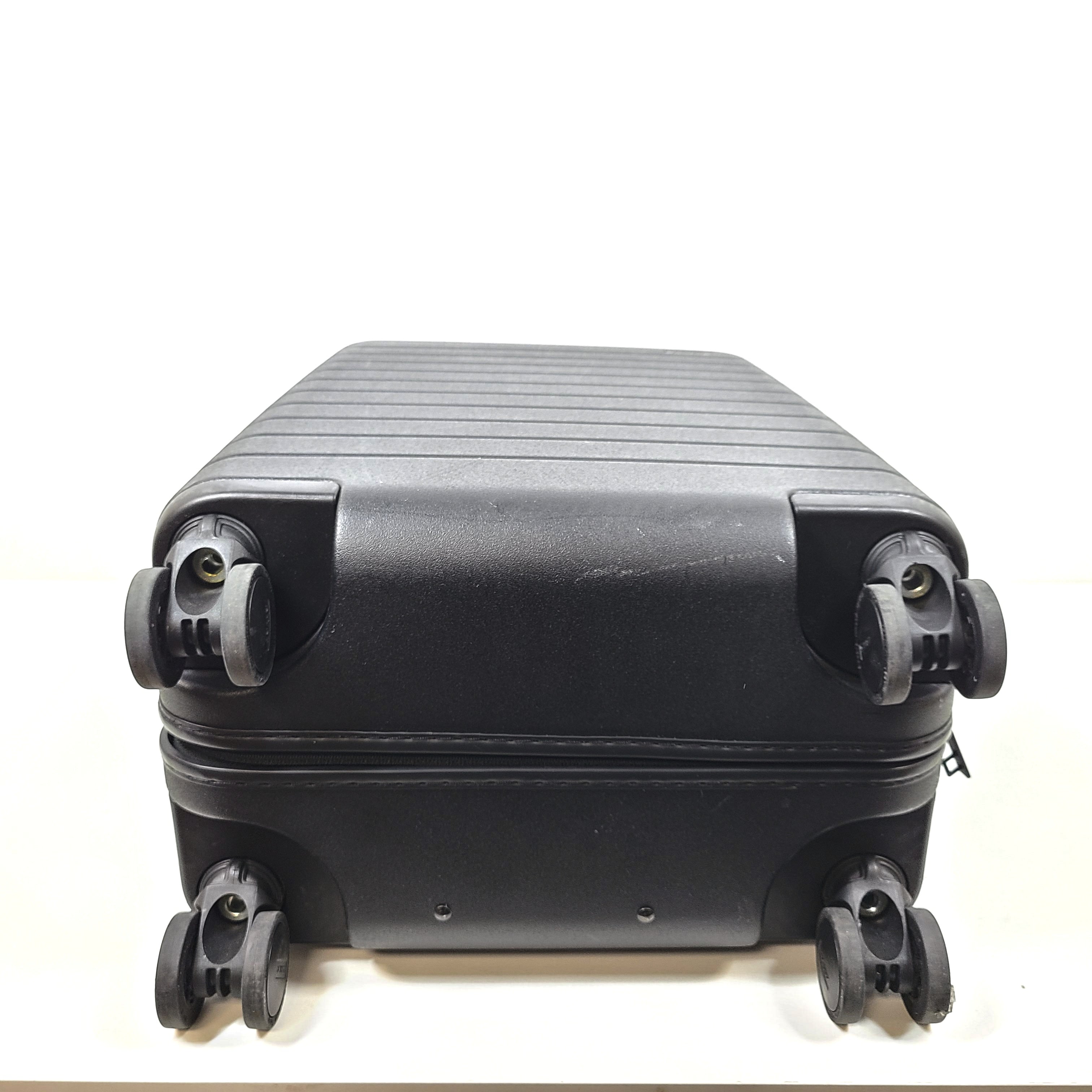 Black Away suitcase with built-in combination lock and organized interior compartments for efficient packing.