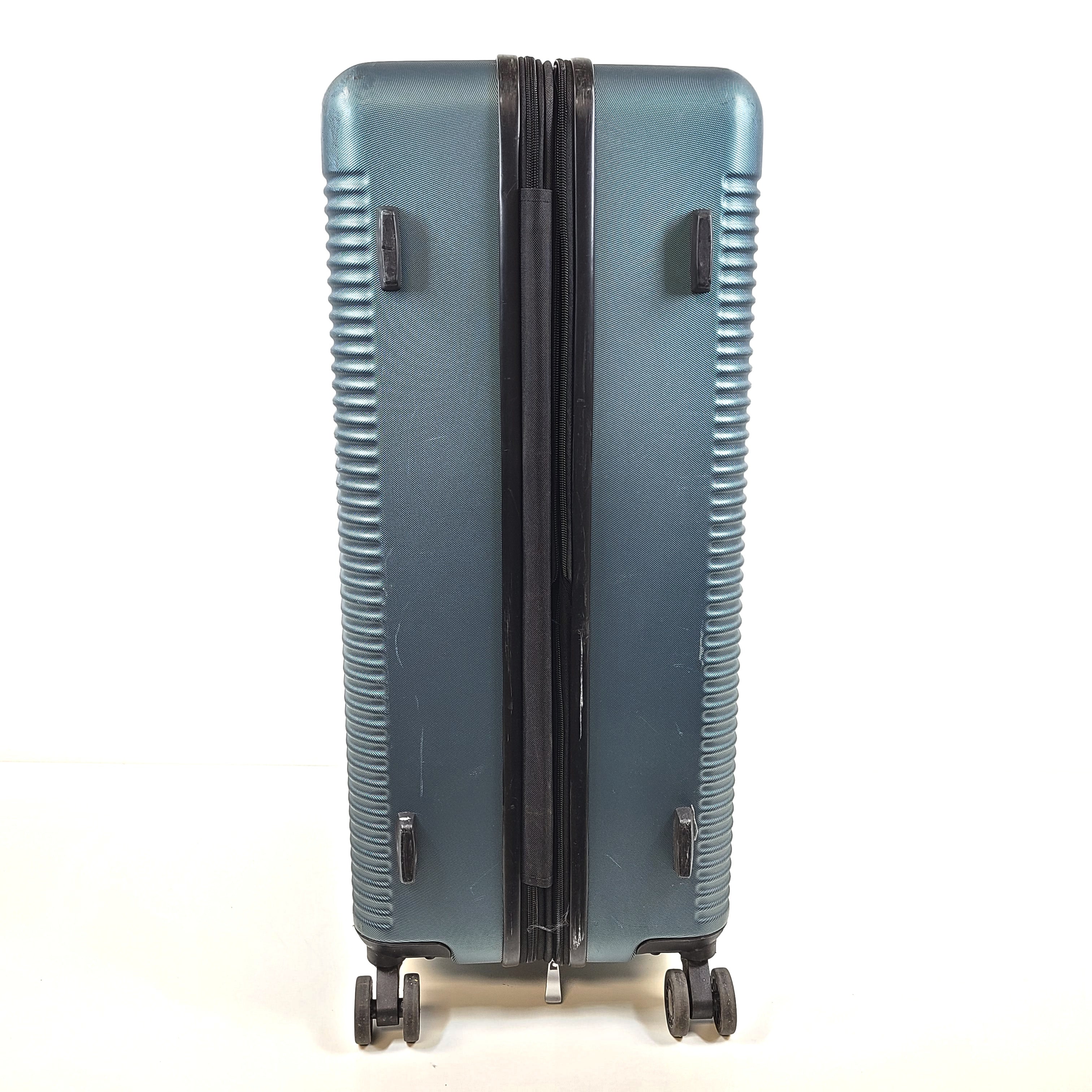 A blue Samsonite suitcase with scuffs and scratches on the exterior and a clean, well-kept interior.