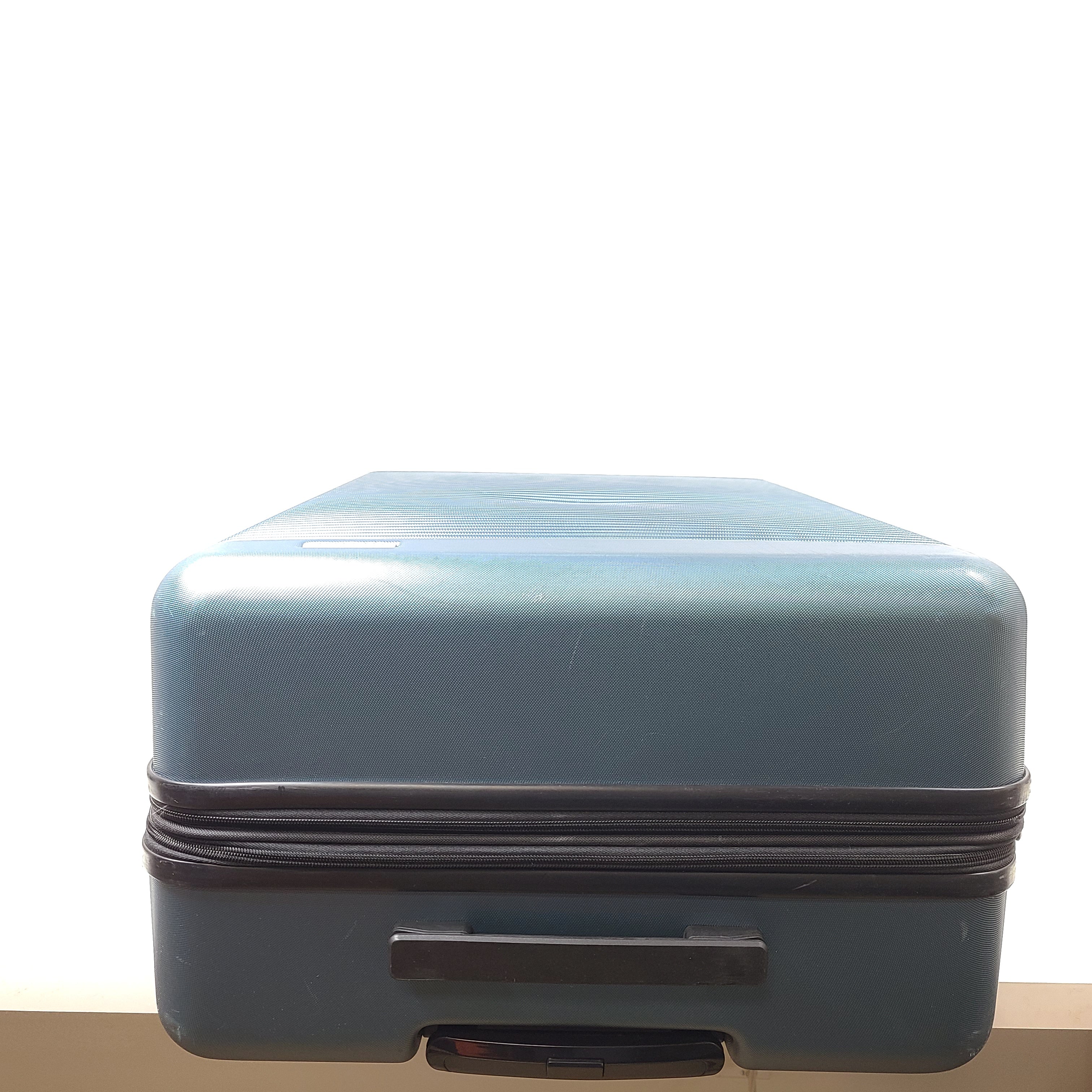 A blue Samsonite suitcase with scuffs and scratches on the exterior and a clean, well-kept interior.