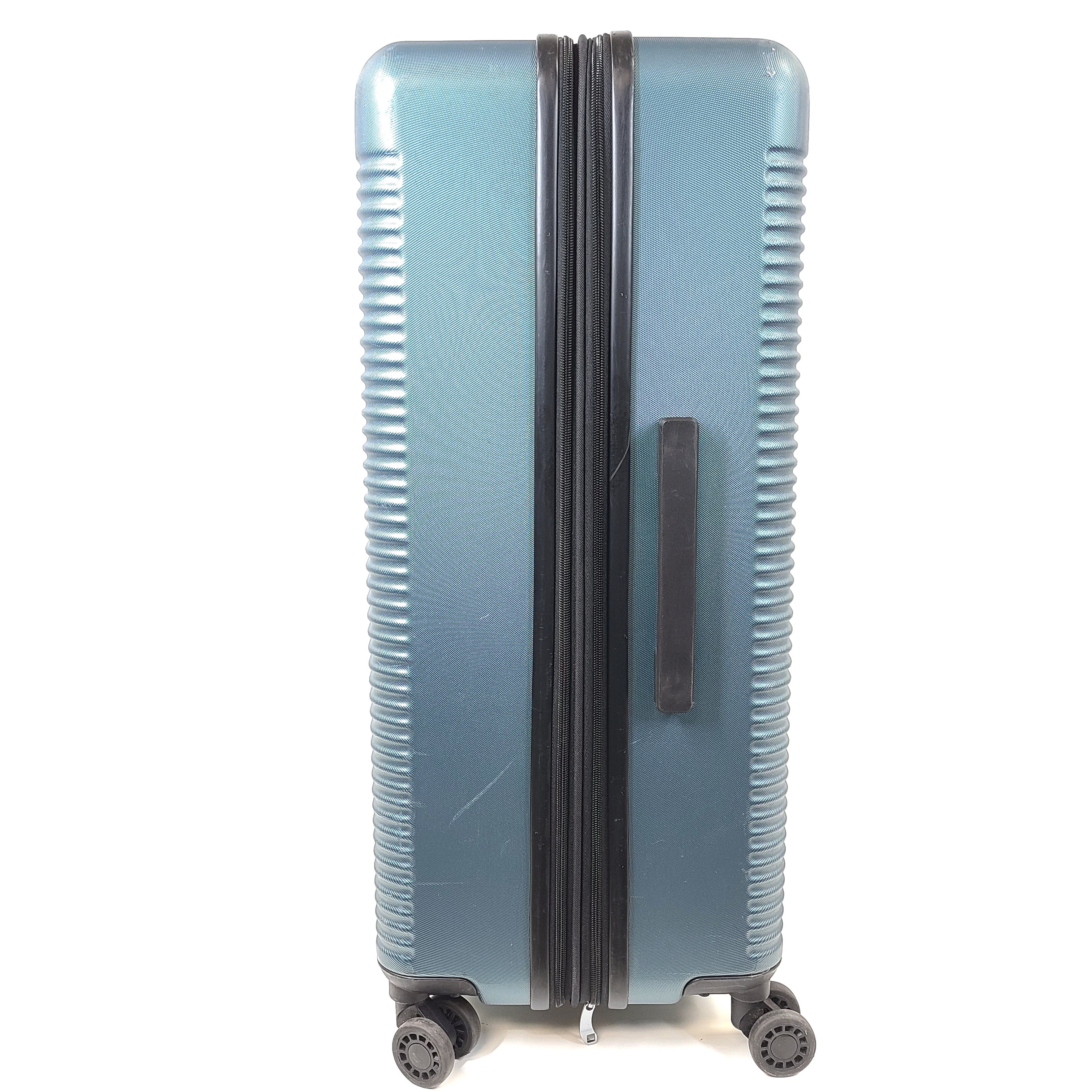 A blue Samsonite suitcase with scuffs and scratches on the exterior and a clean, well-kept interior.