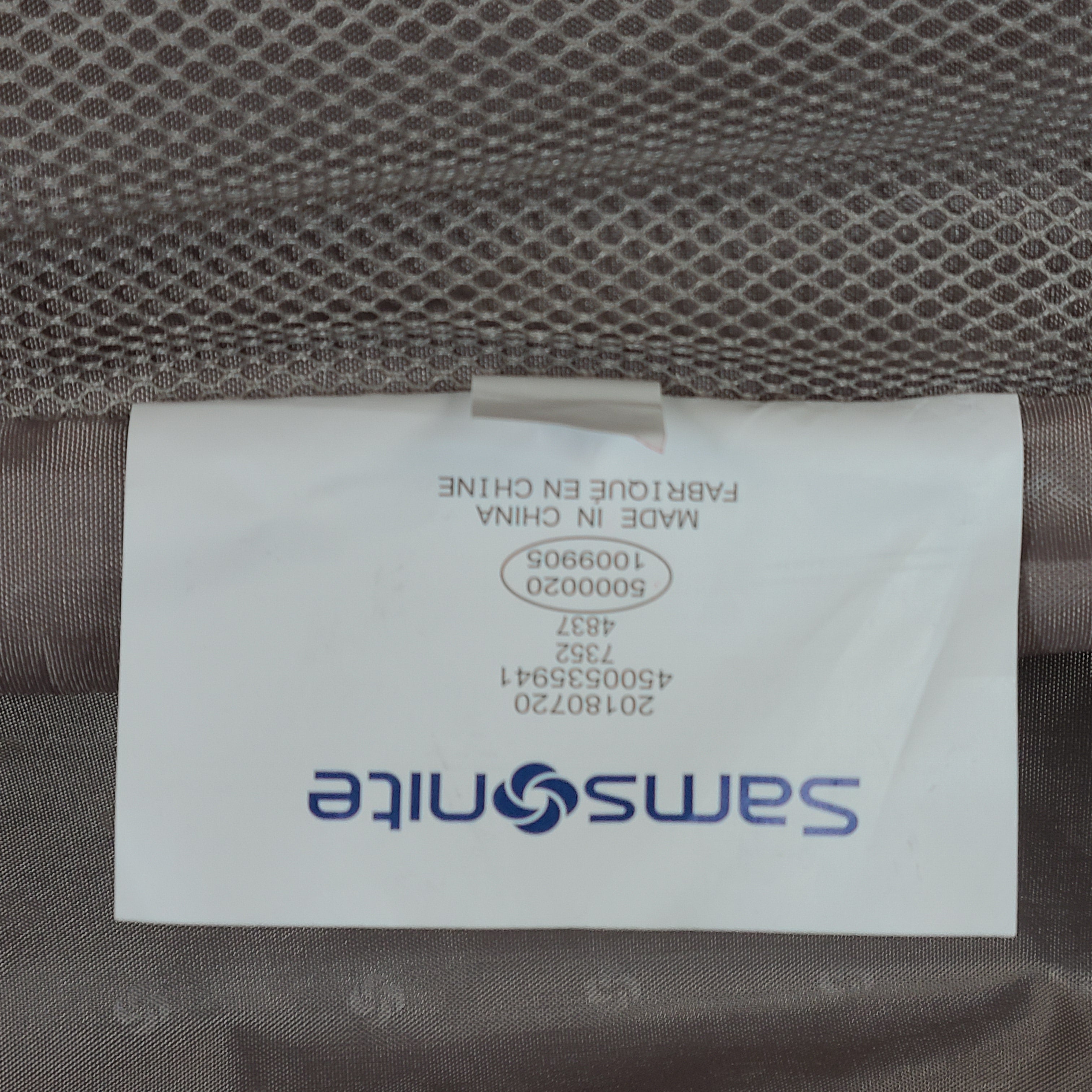 Gray Samsonite suitcase model 73652 with minor exterior scratches and light wear.