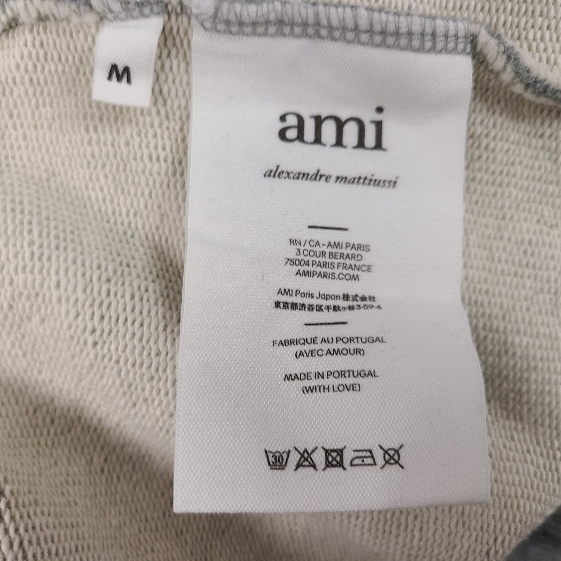 Grey and black AMI Alexandre Mattiussi shorts with a heart patch in organic cotton.