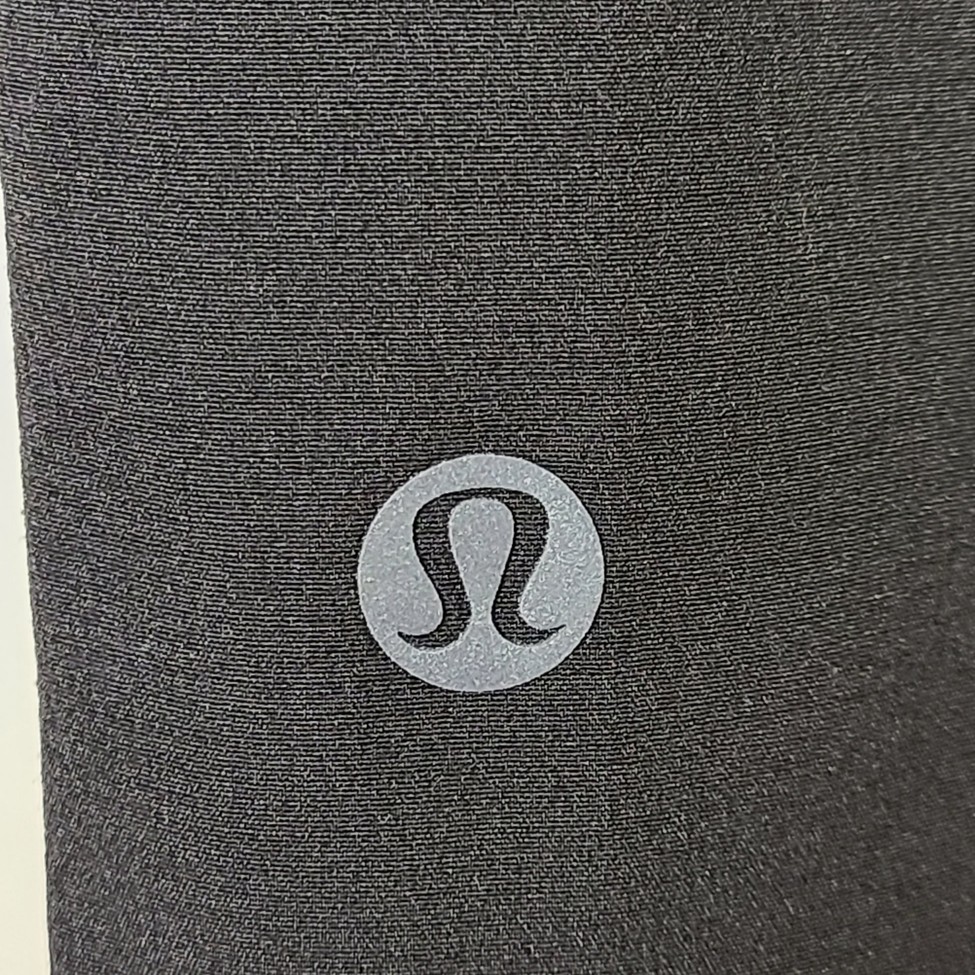 Black Lululemon joggers size XL with elastic waistband and tapered leg for comfortable everyday wear.