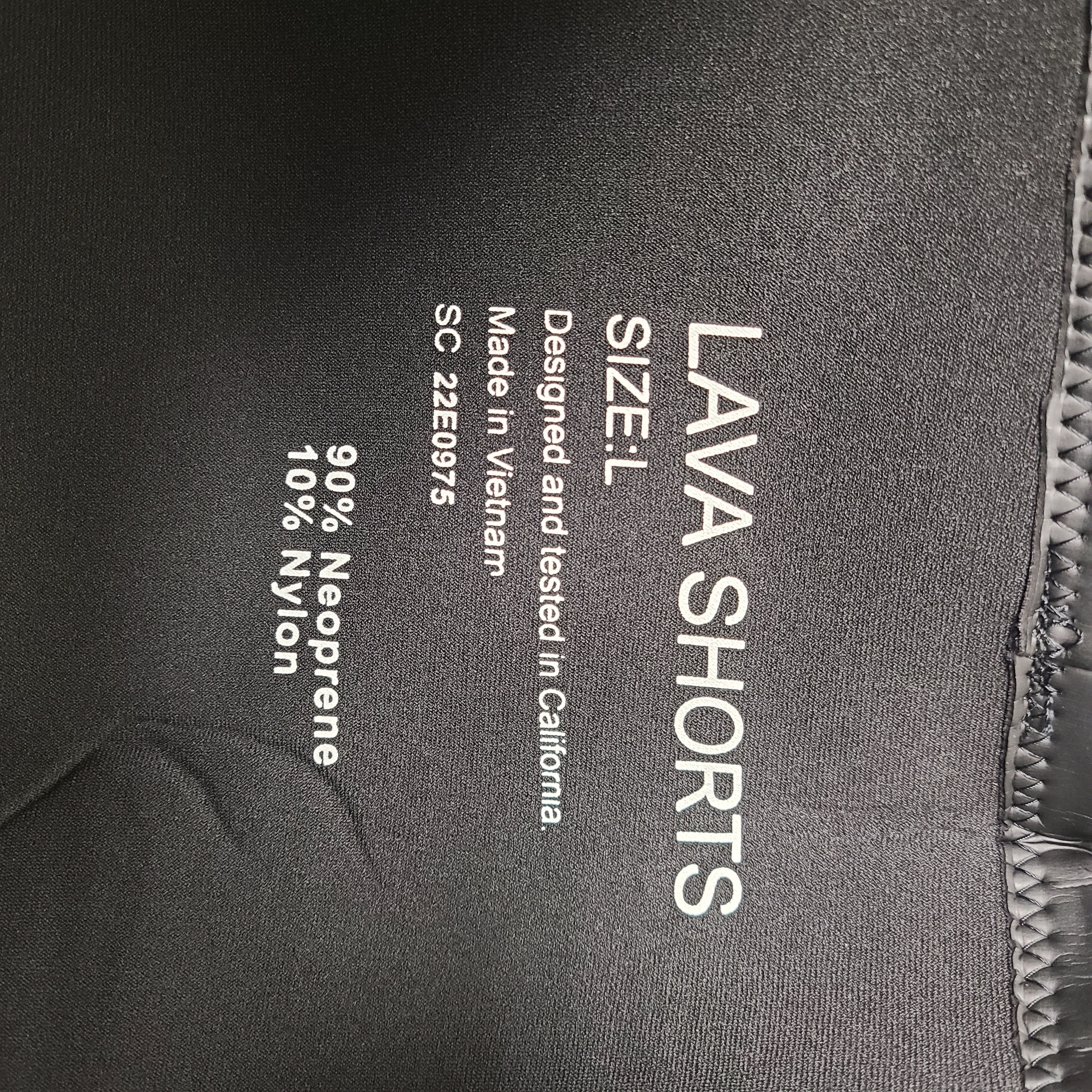 Black and blue Xterra Lava neoprene shorts in size L with nylon panels and reinforced seams.