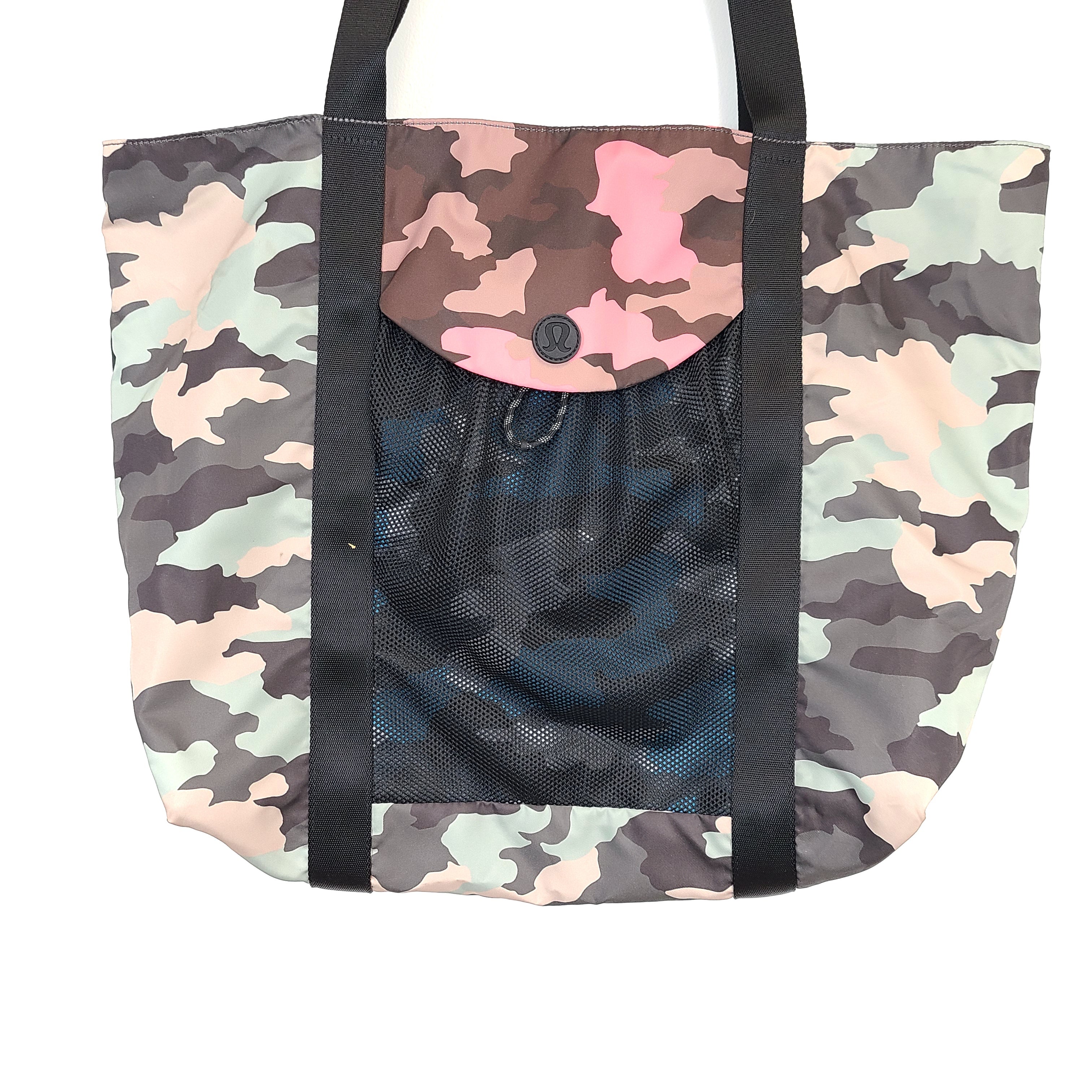 Multicolor Lululemon camouflage tote with pink, brown, green and blue panels and an internal label reading "items of importance".