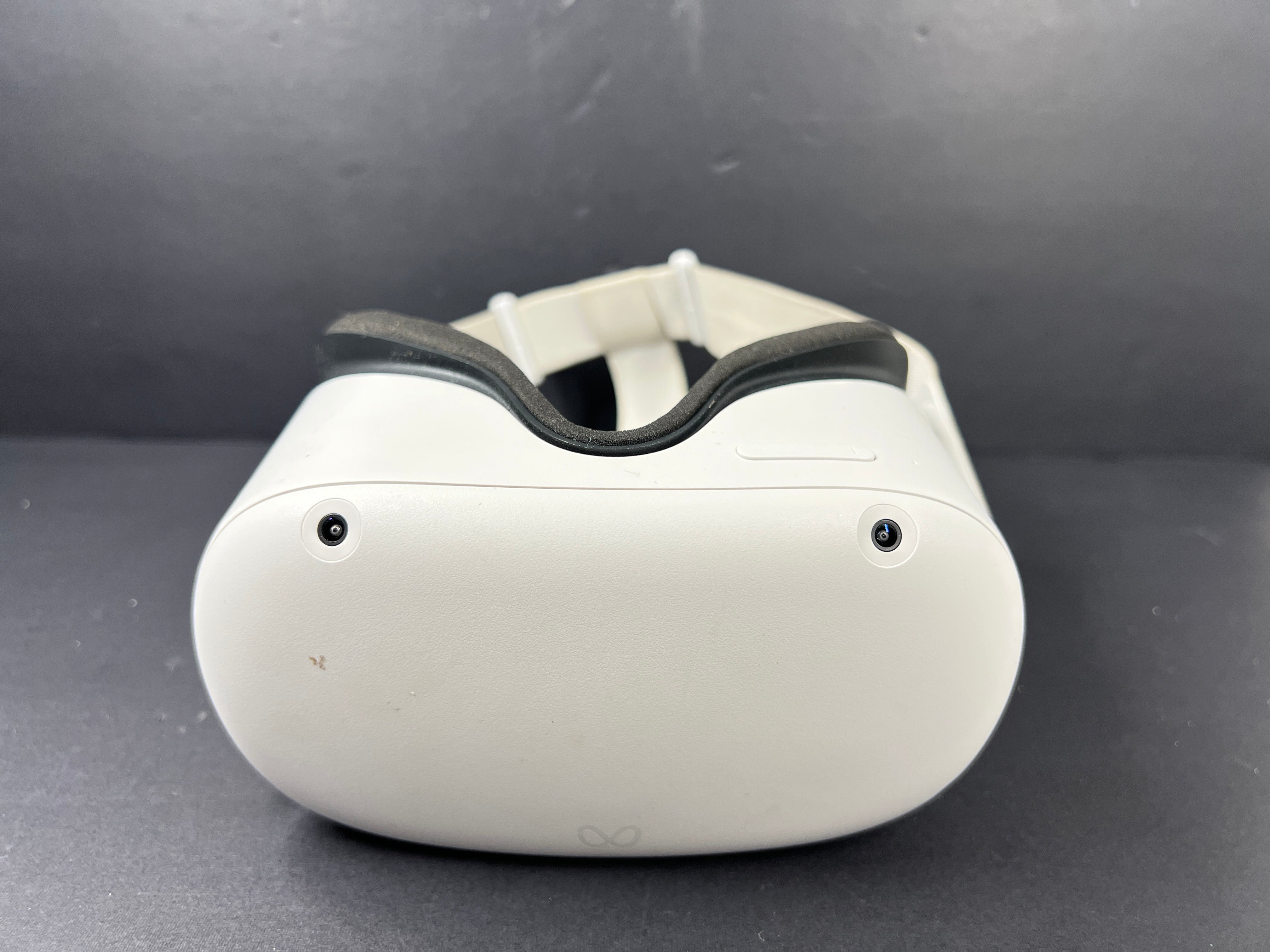 Close-up of Meta Quest 2 VR headset model label with branding, certification logos, and model number KW49CM visible.