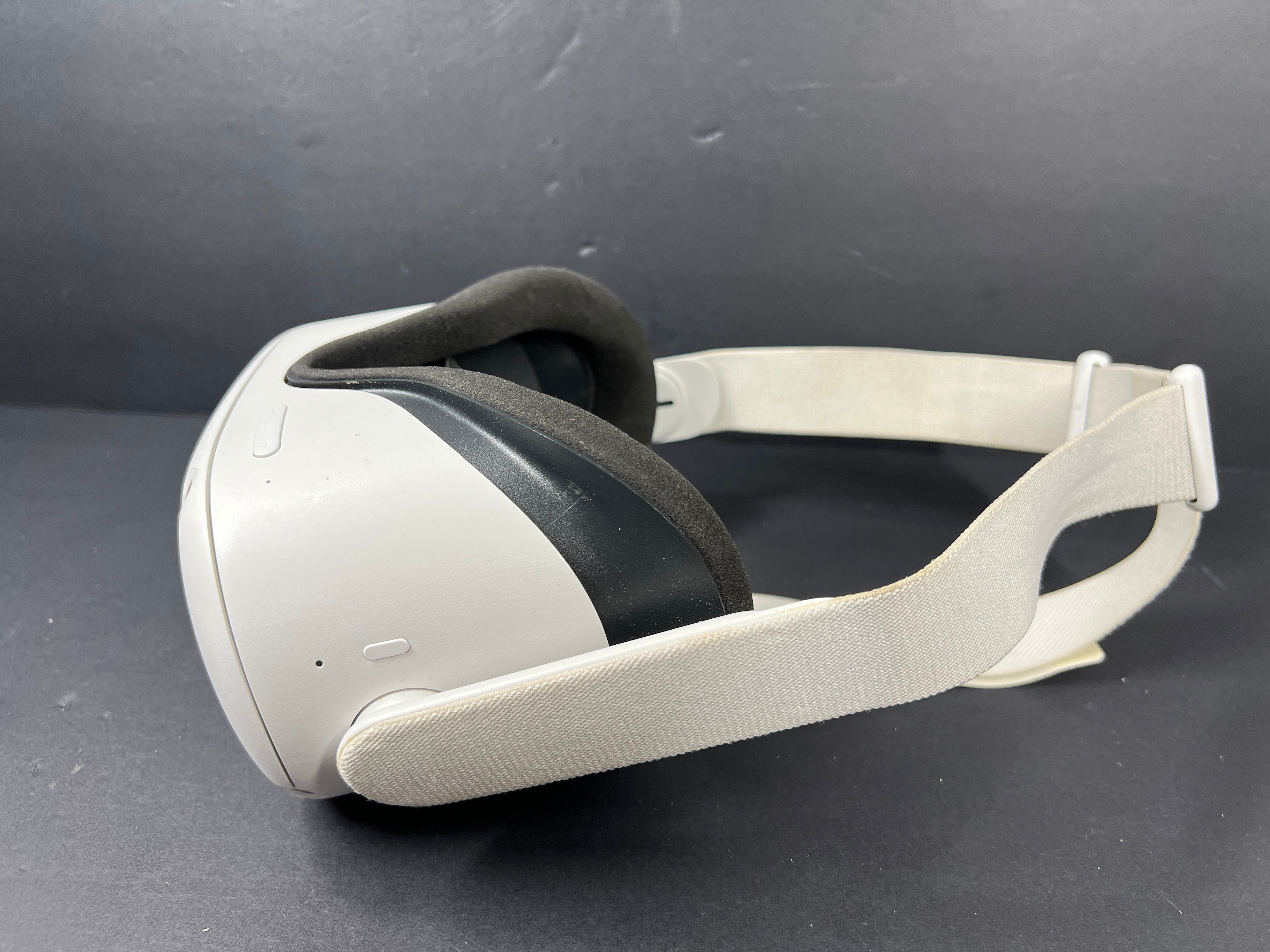 Close-up of Meta Quest 2 VR headset model label with branding, certification logos, and model number KW49CM visible.