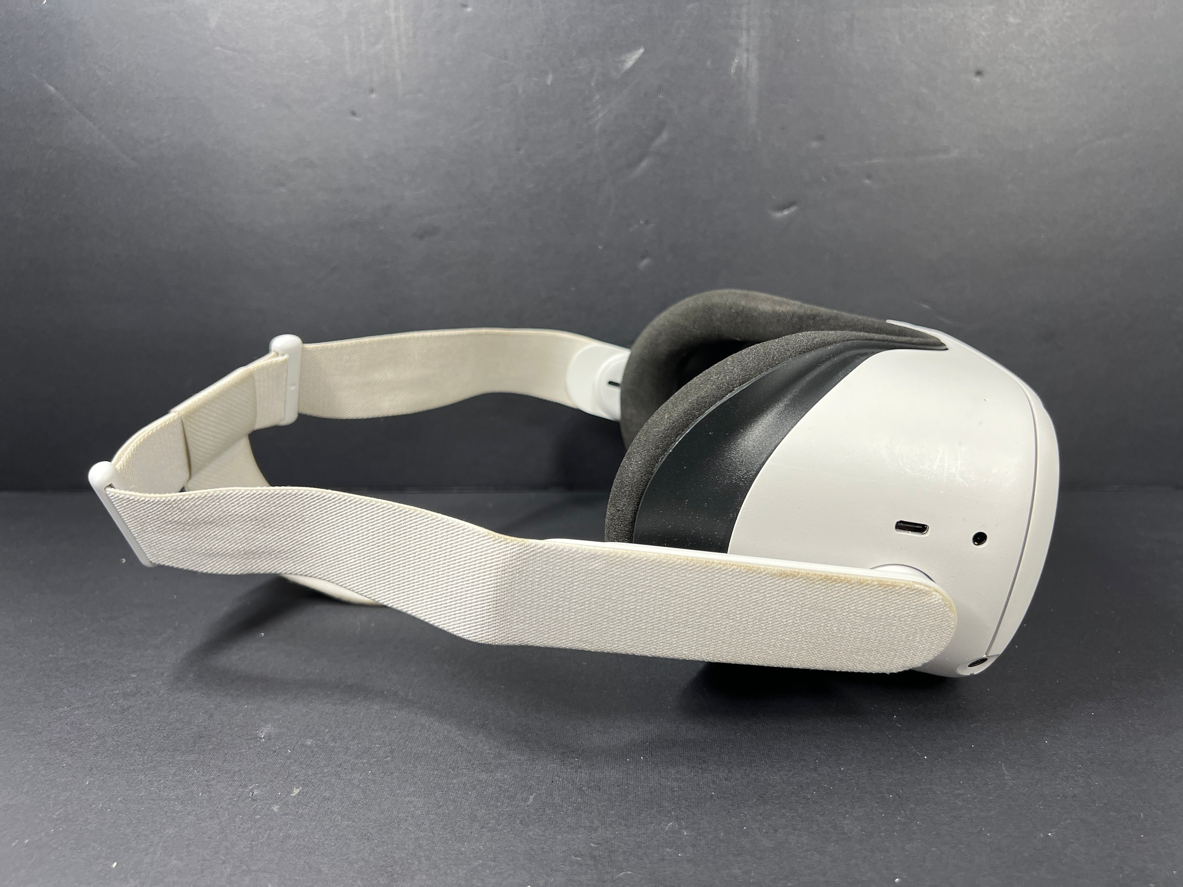 Close-up of Meta Quest 2 VR headset model label with branding, certification logos, and model number KW49CM visible.