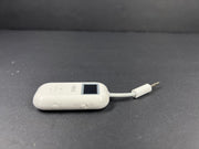 Small white Bluetooth audio adapter with display and 3.5mm jack designed for wireless headphone use on planes