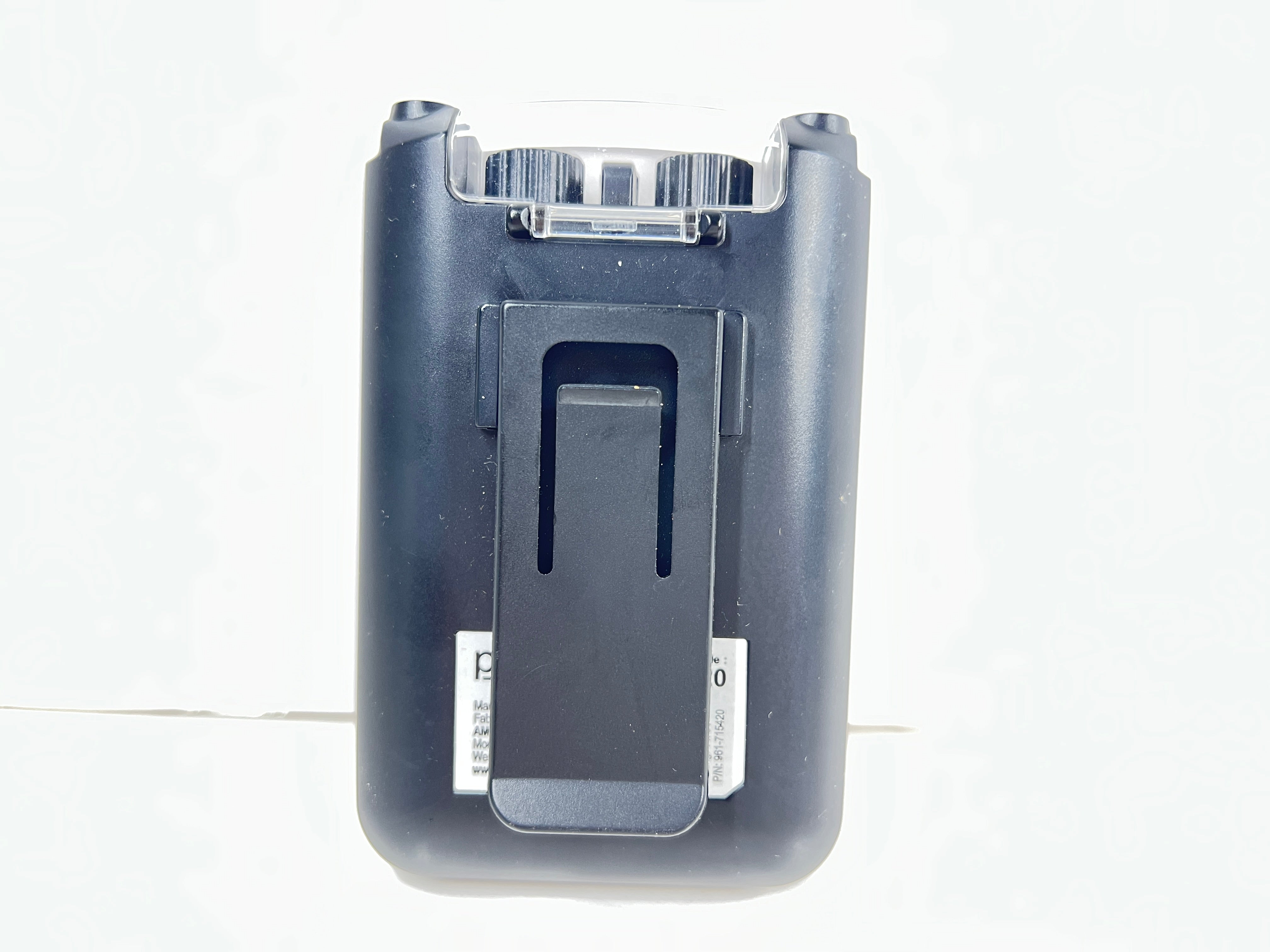 Close-up of black AMG Medical dual-channel TENS unit with belt clip and CH1/CH2 dials