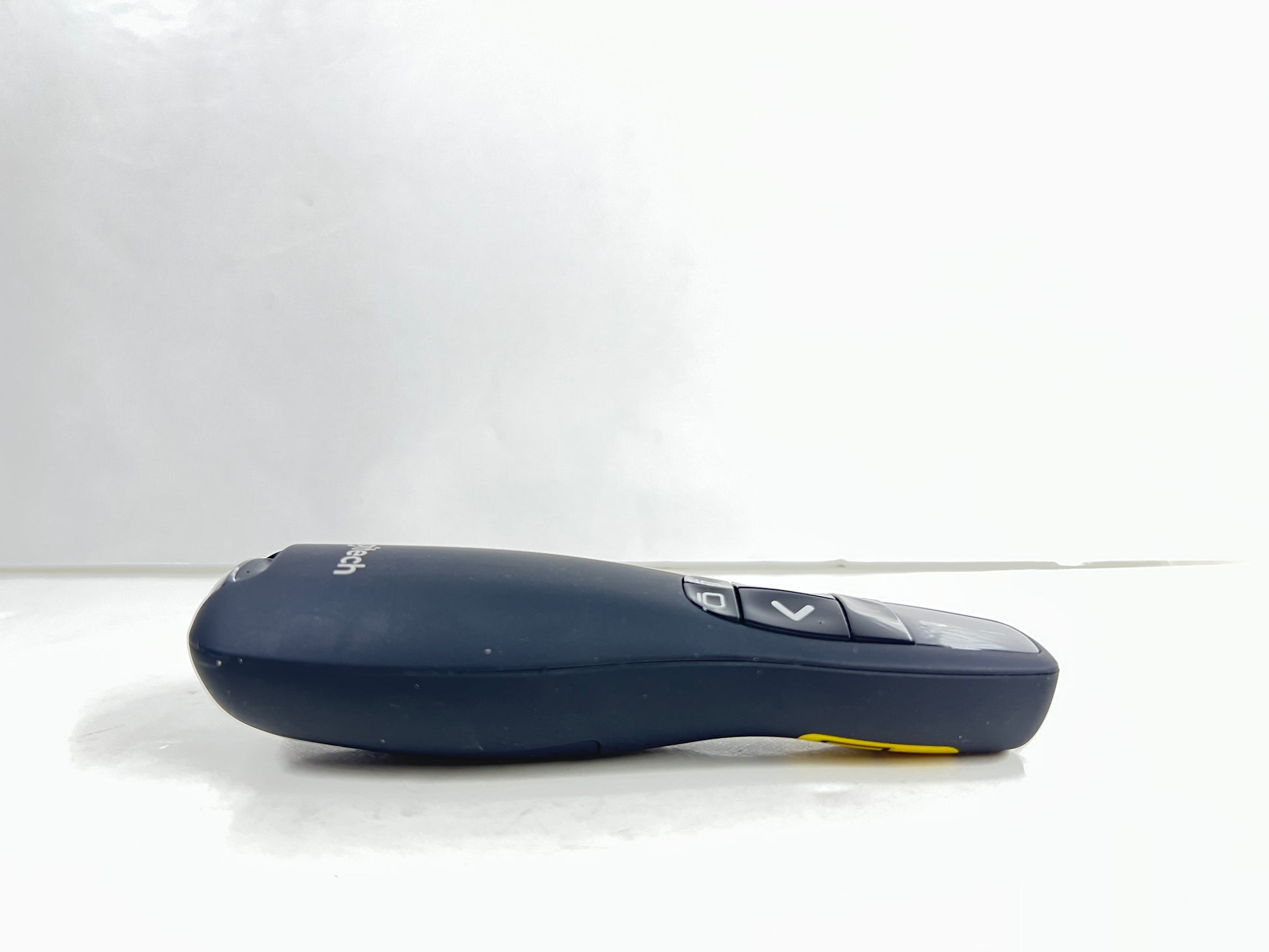 Black Logitech R400 wireless presentation remote with laser pointer and slideshow controls shown from multiple angles.