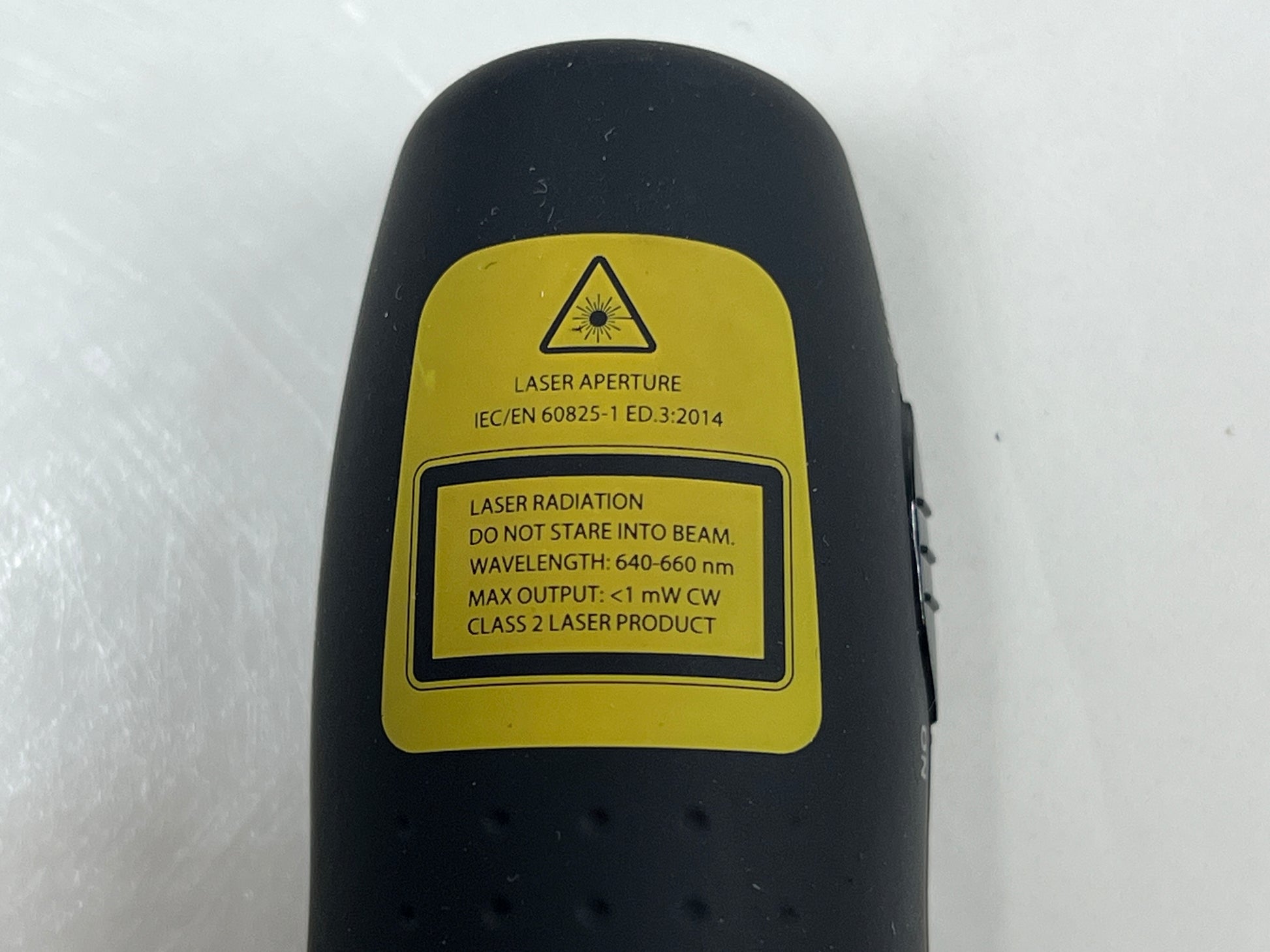 Black Logitech R400 wireless presentation remote with laser pointer and slideshow controls shown from multiple angles.