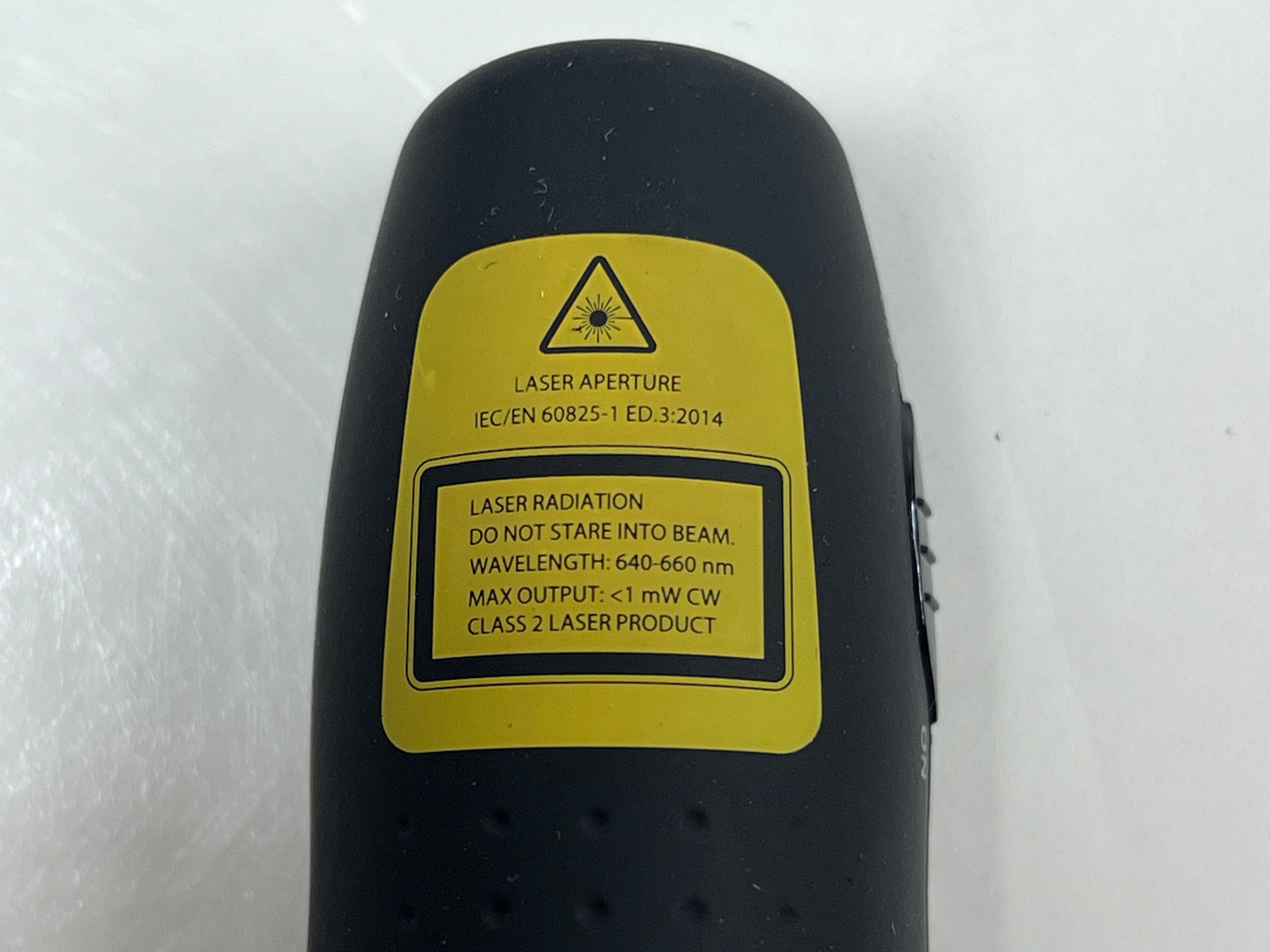 Black Logitech R400 wireless presentation remote with laser pointer and slideshow controls shown from multiple angles.