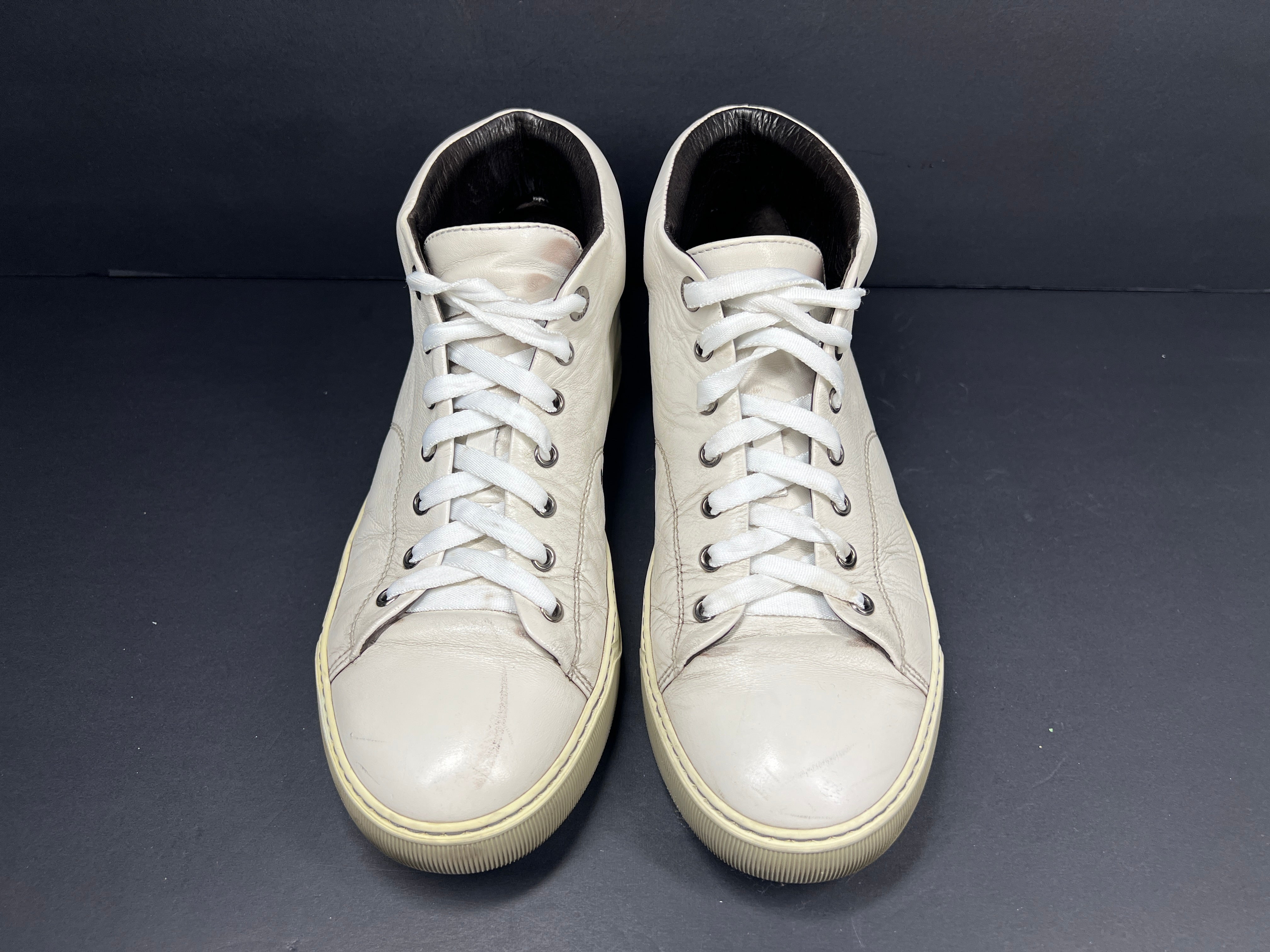 A pair of white leather high-top sneakers by Lanvin
