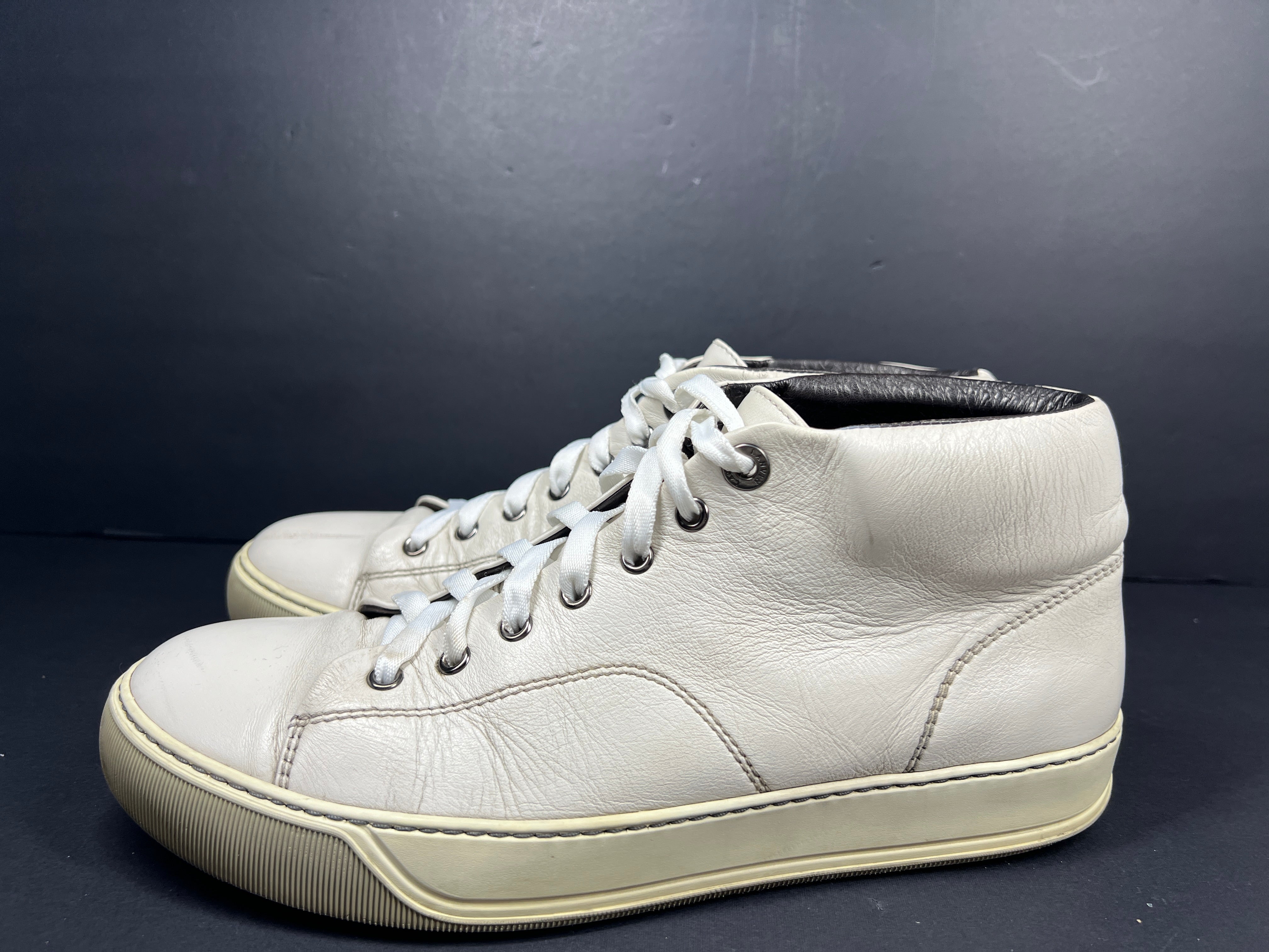 A pair of white leather high-top sneakers by Lanvin