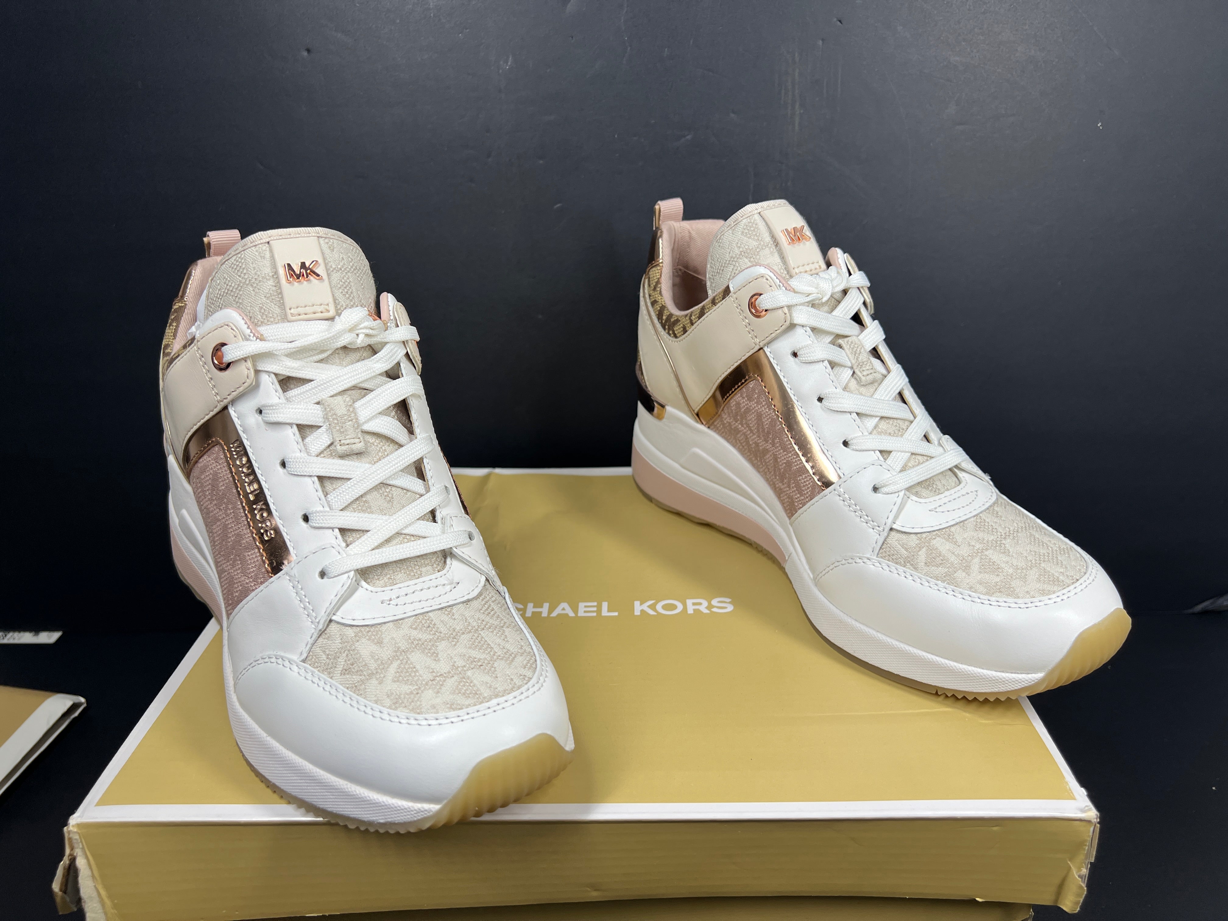 A pair of Men's Michael Kors shoes in natural color and size 8.5M