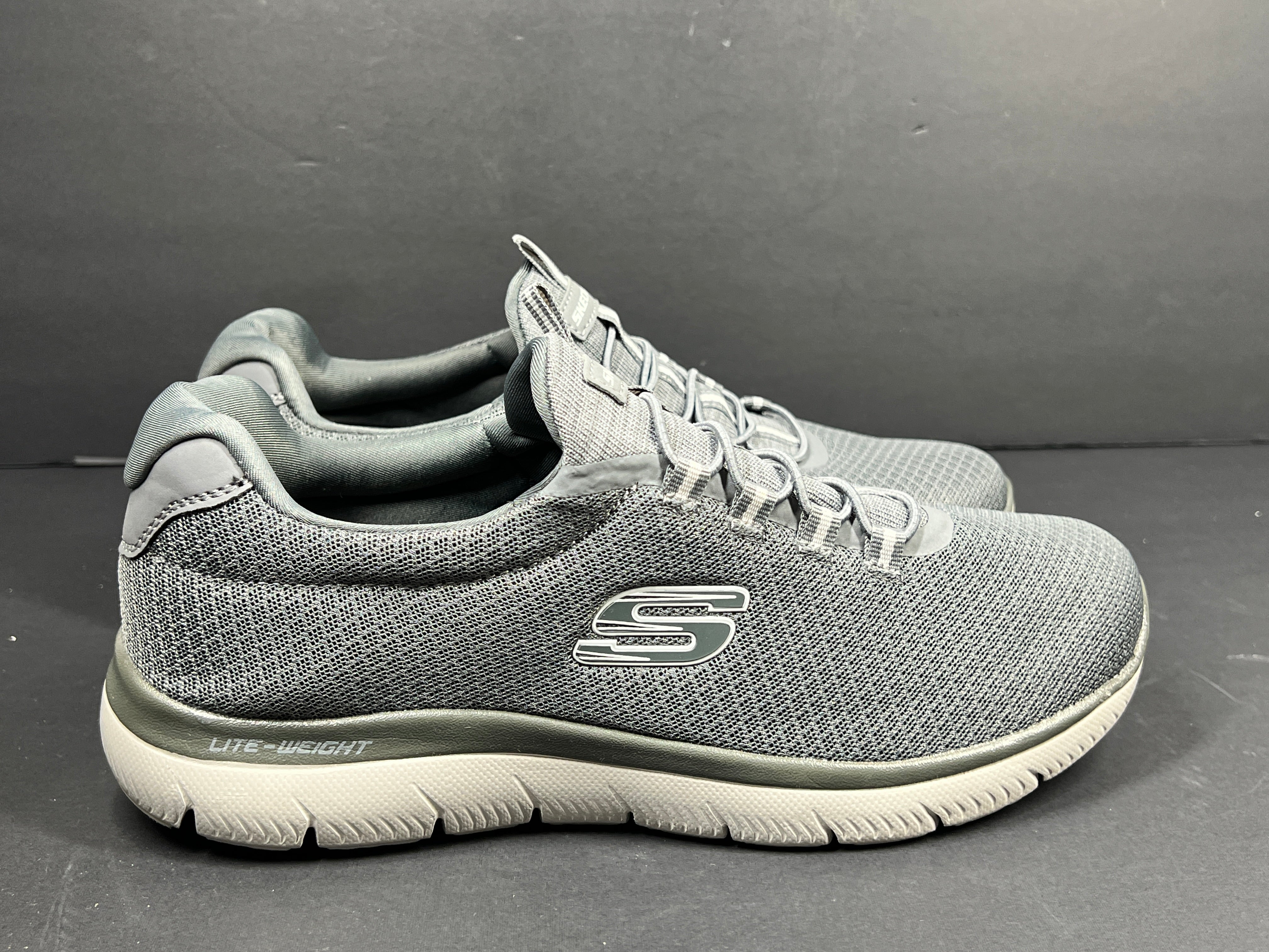 A pair of men's Skechers Wide Fit Memory Foam Charcoal Sneakers