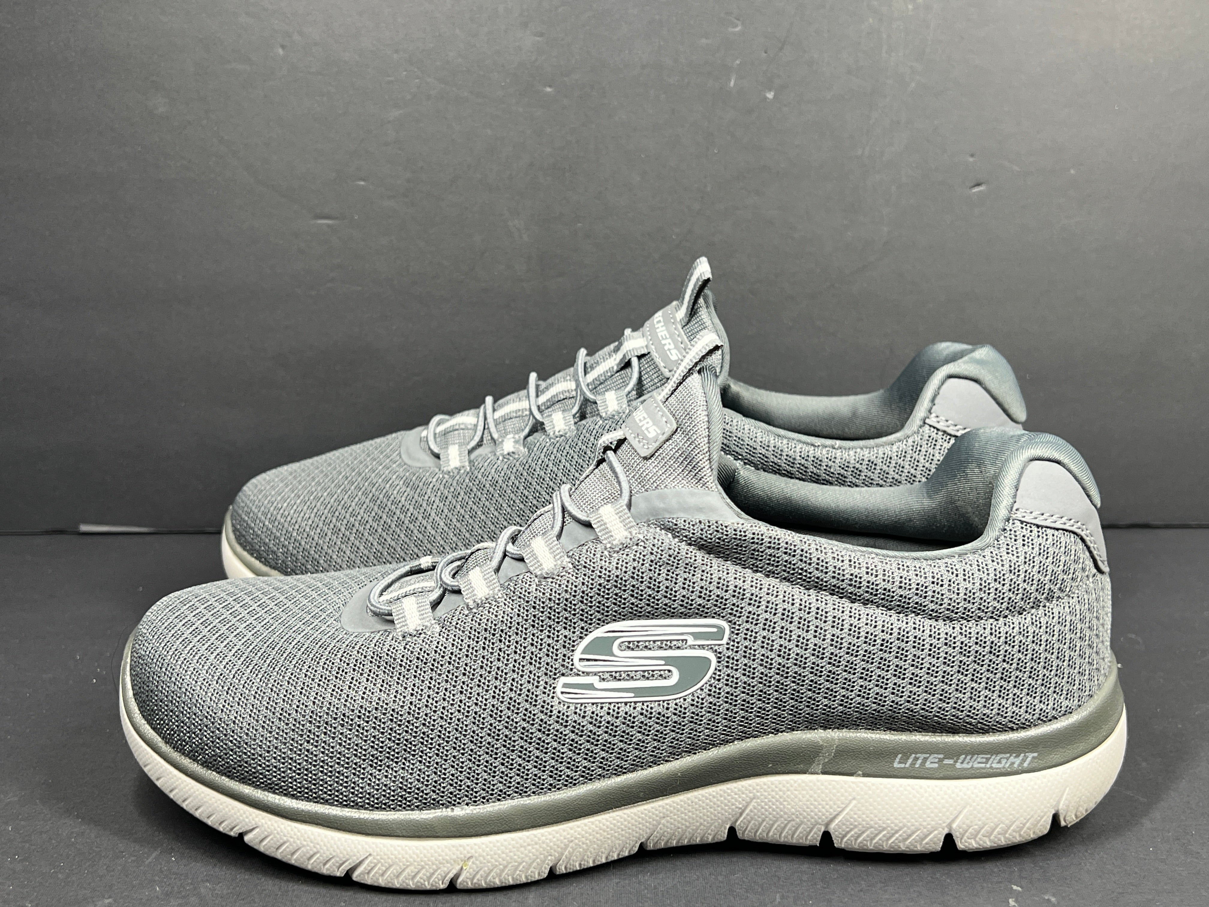 A pair of men's Skechers Wide Fit Memory Foam Charcoal Sneakers