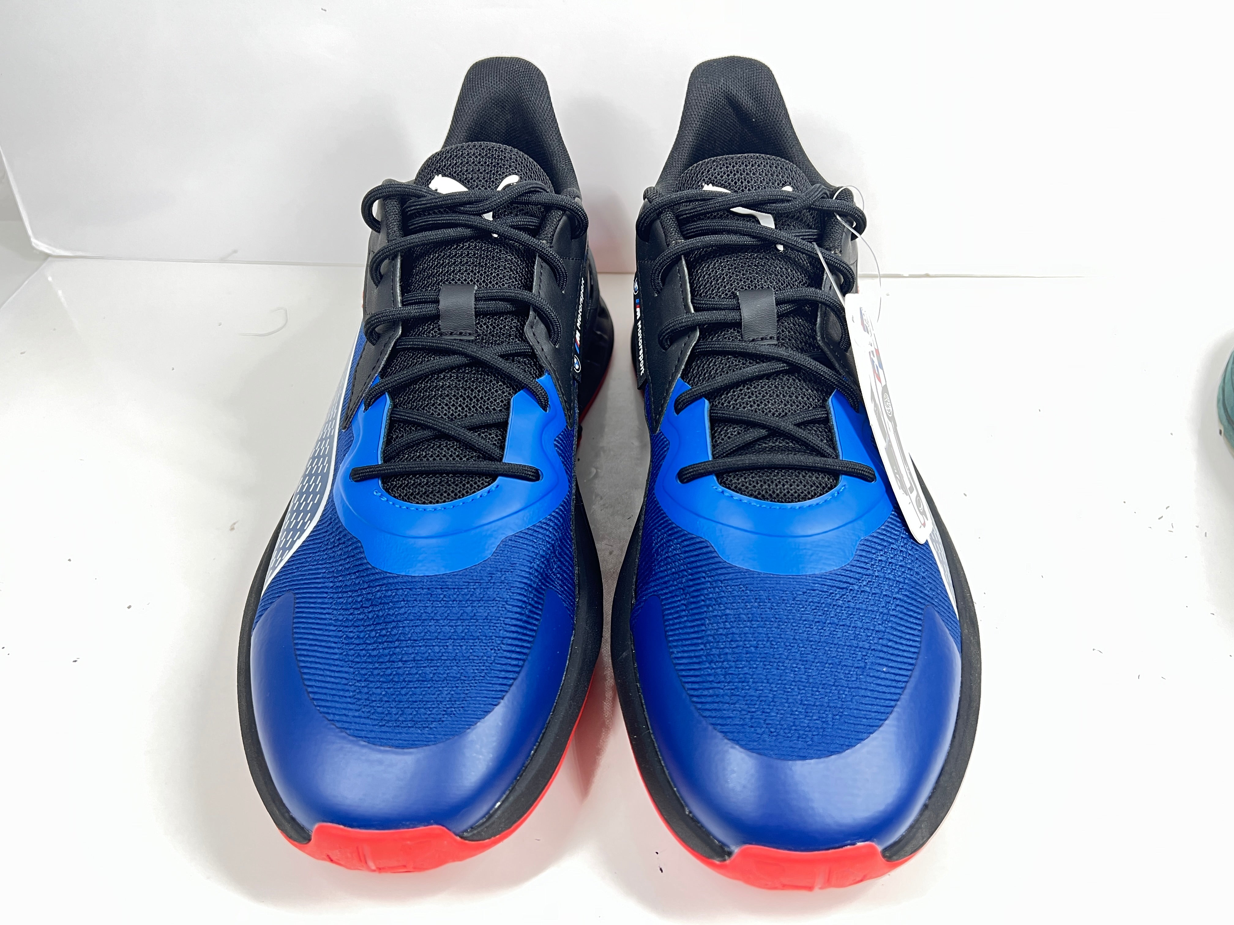A stylish pair of Puma BMW MMS X-Ray 2 Sneakers in Blue, Black, and Red colors