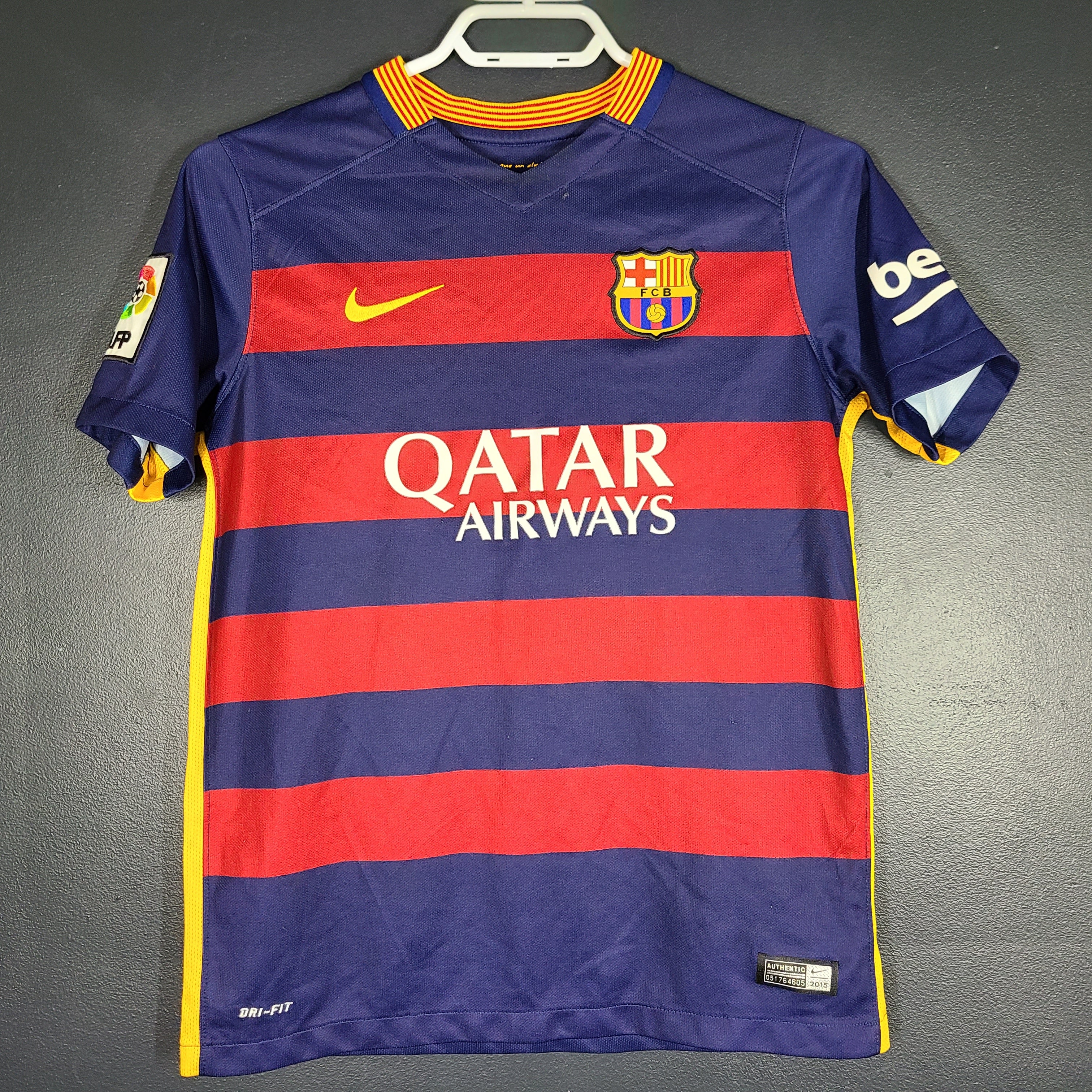 FC Barcelona 2015 youth home jersey in red and navy with Qatar Airways and UNICEF logos visible.