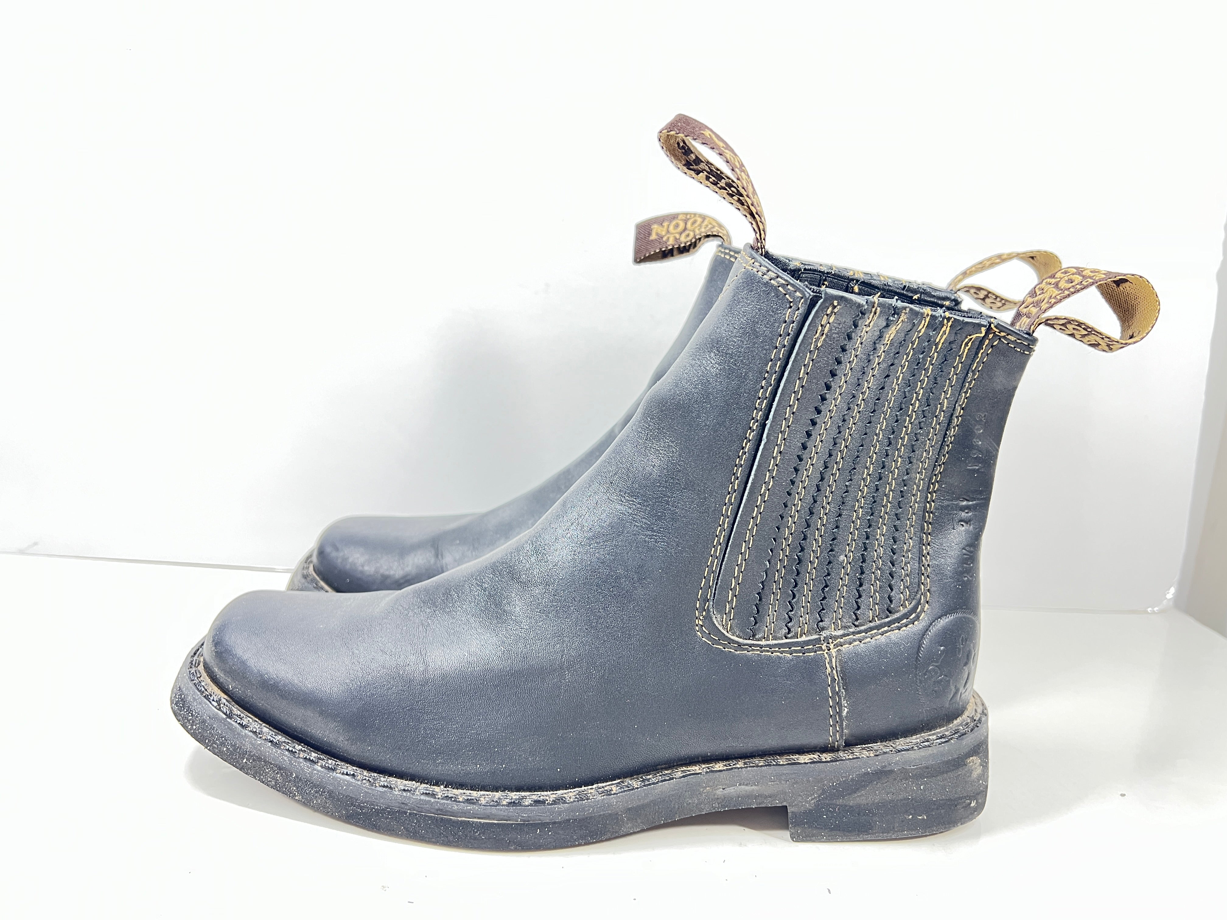 A pair of black leather women's boots by Nookie Town.