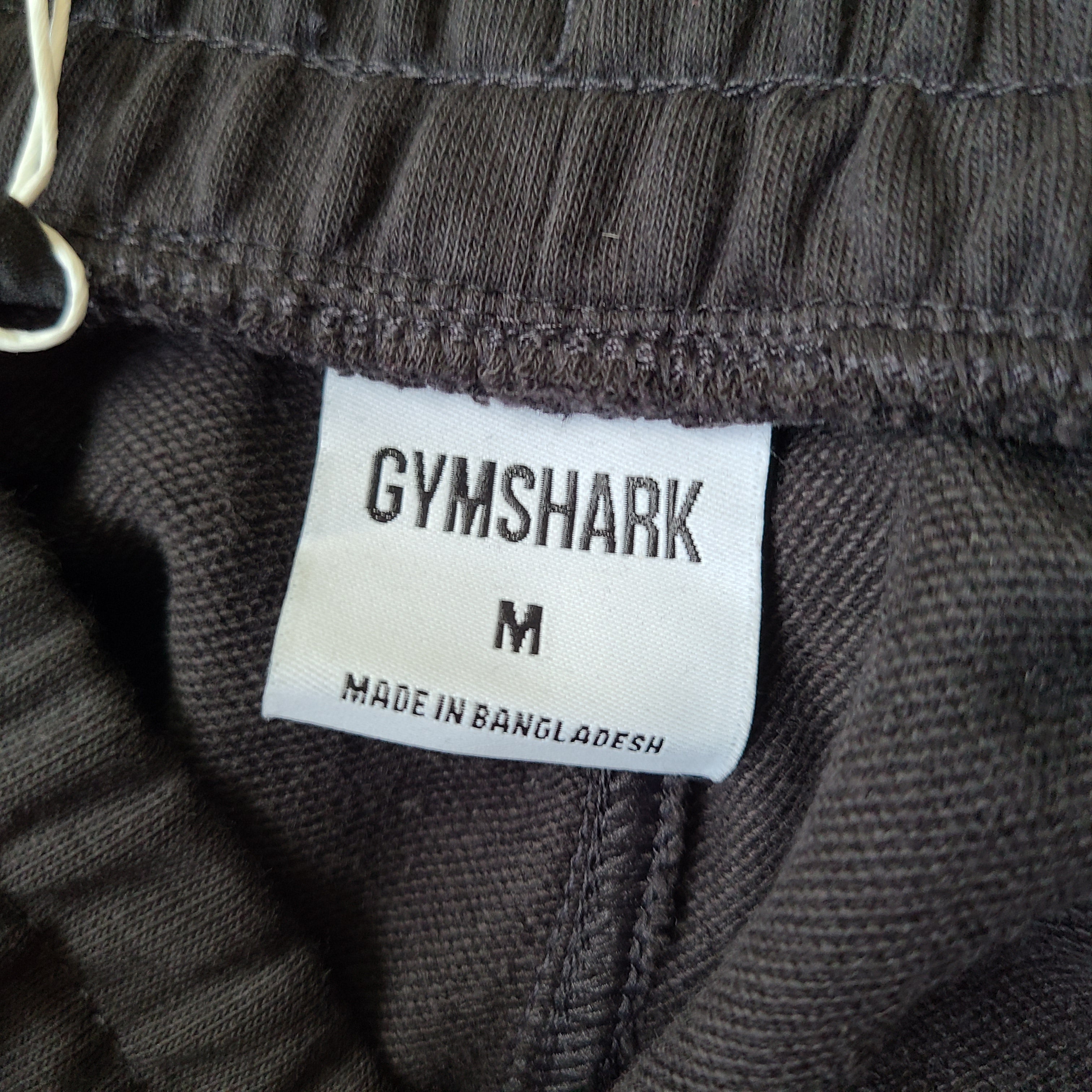 A pair of black oversized joggers by Gymshark.