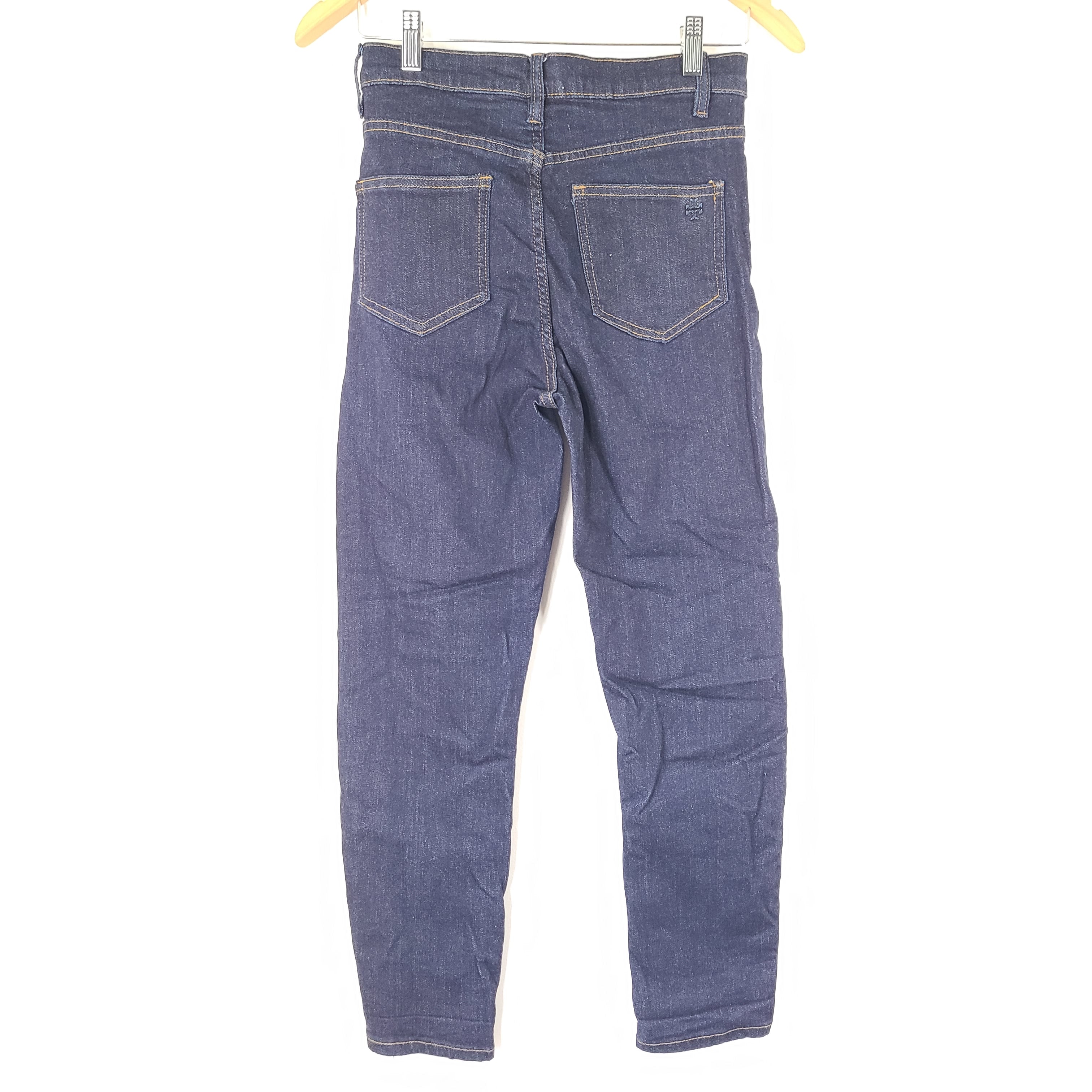 A pair of dark denim women's high-rise skinny jeans from Tory Burch