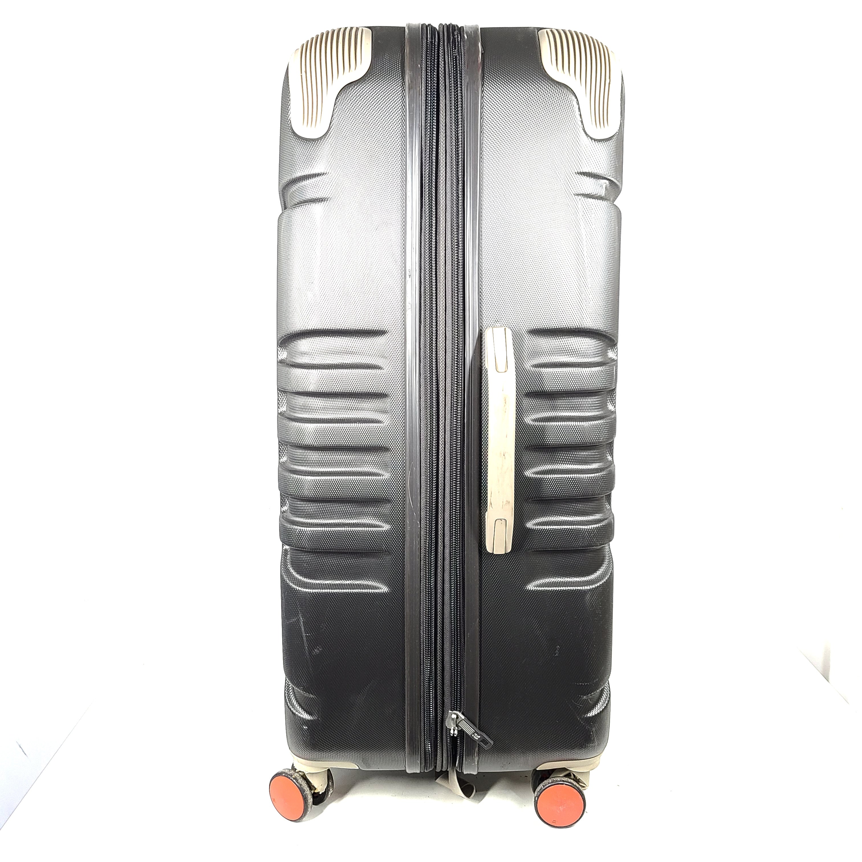A red hard shell spinner suitcase by it Luggage