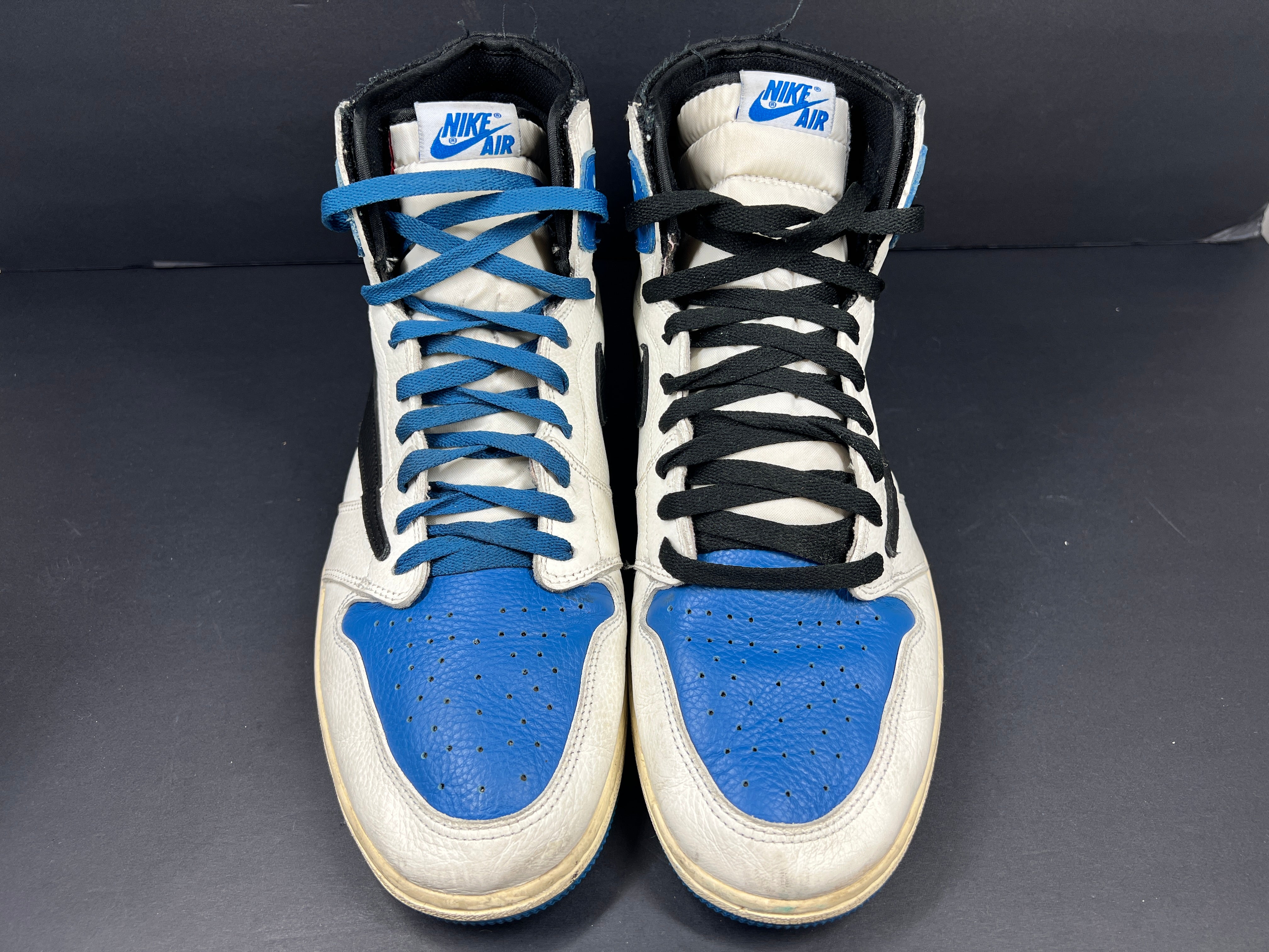 A pair of blue Nike Air Jordan 1 Retro High OG sneakers