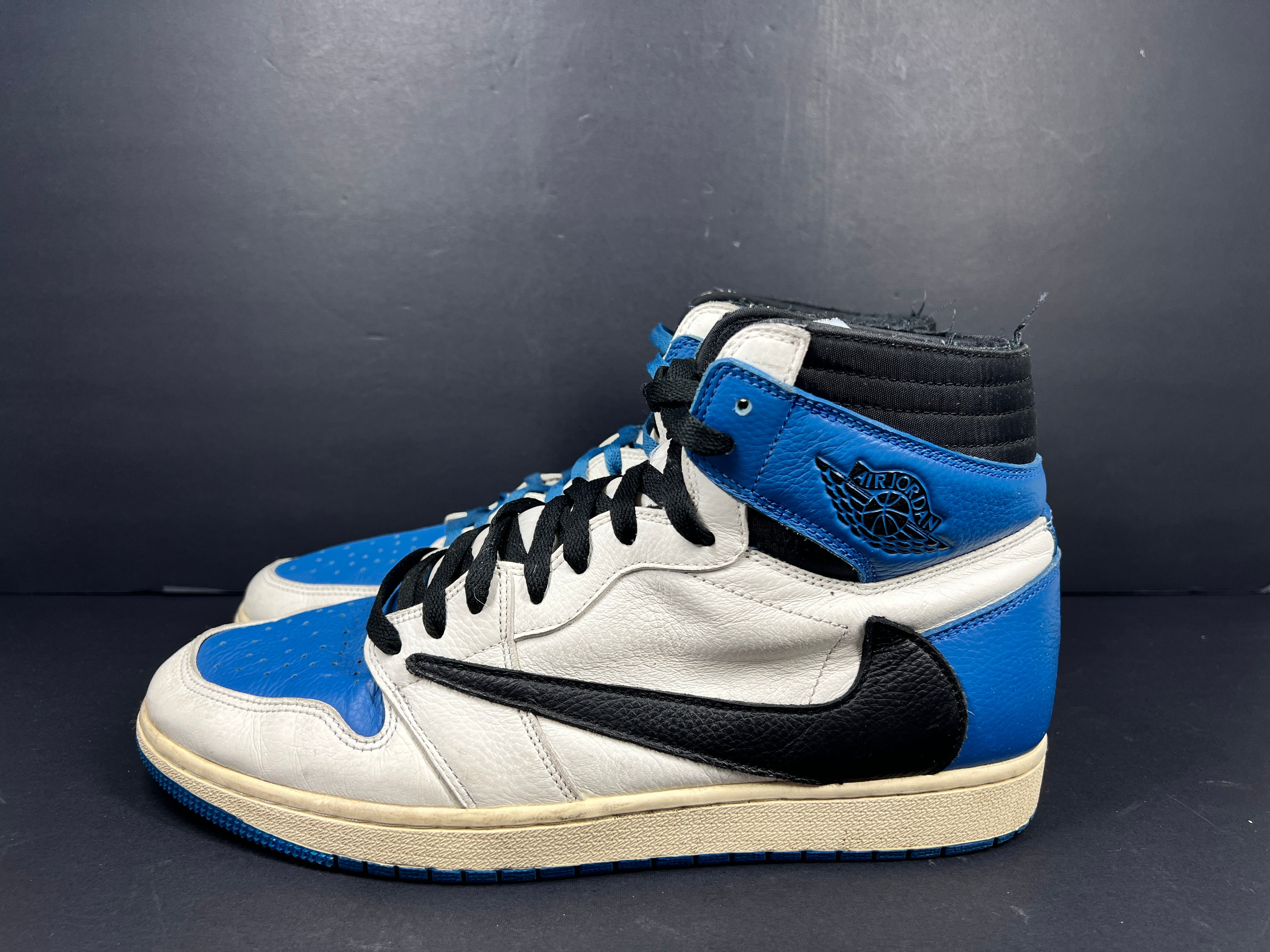 A pair of blue Nike Air Jordan 1 Retro High OG sneakers
