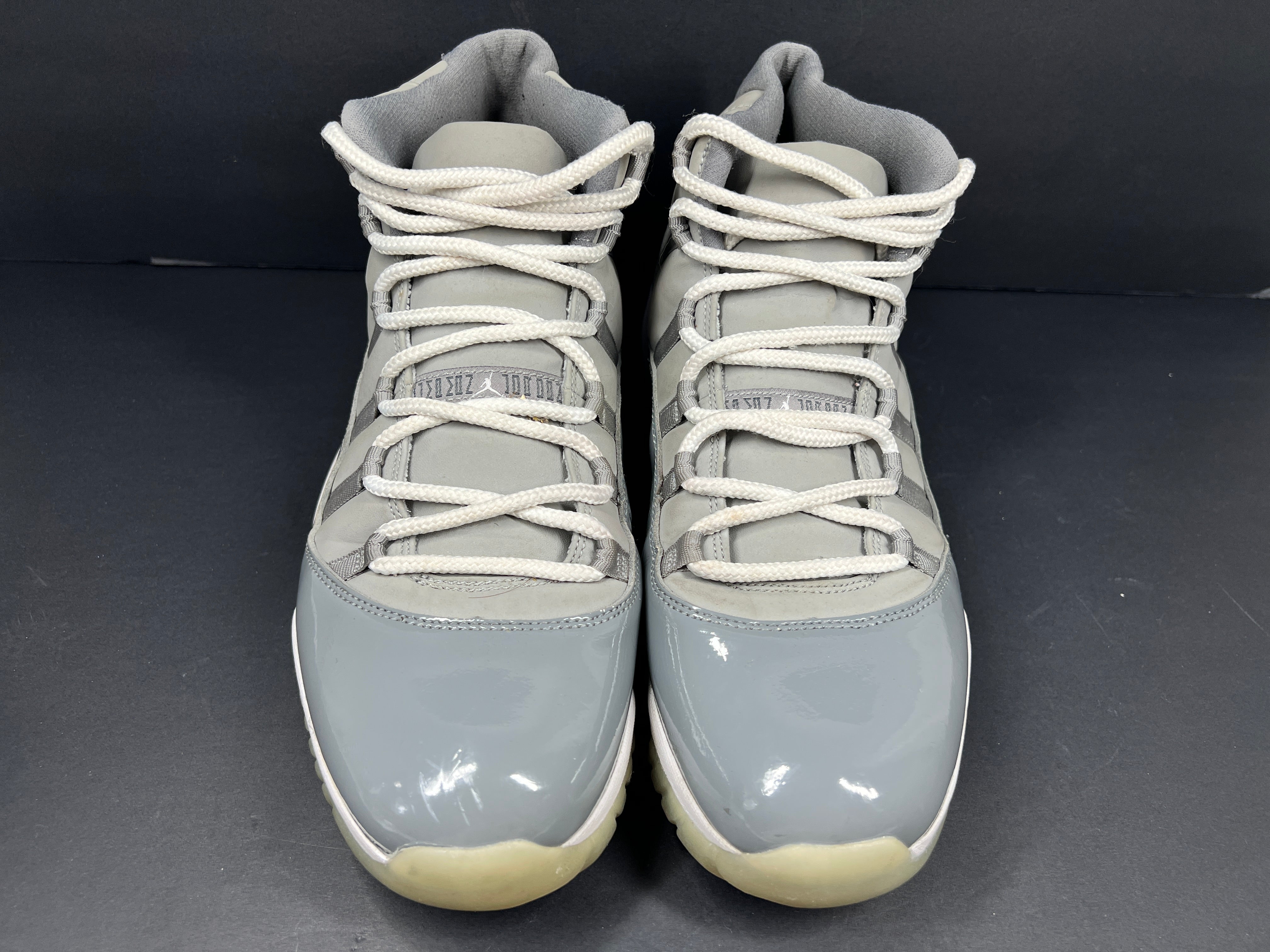 A pair of Nike Air Jordan 11 Retro "Cool Grey" Men's Basketball Shoes