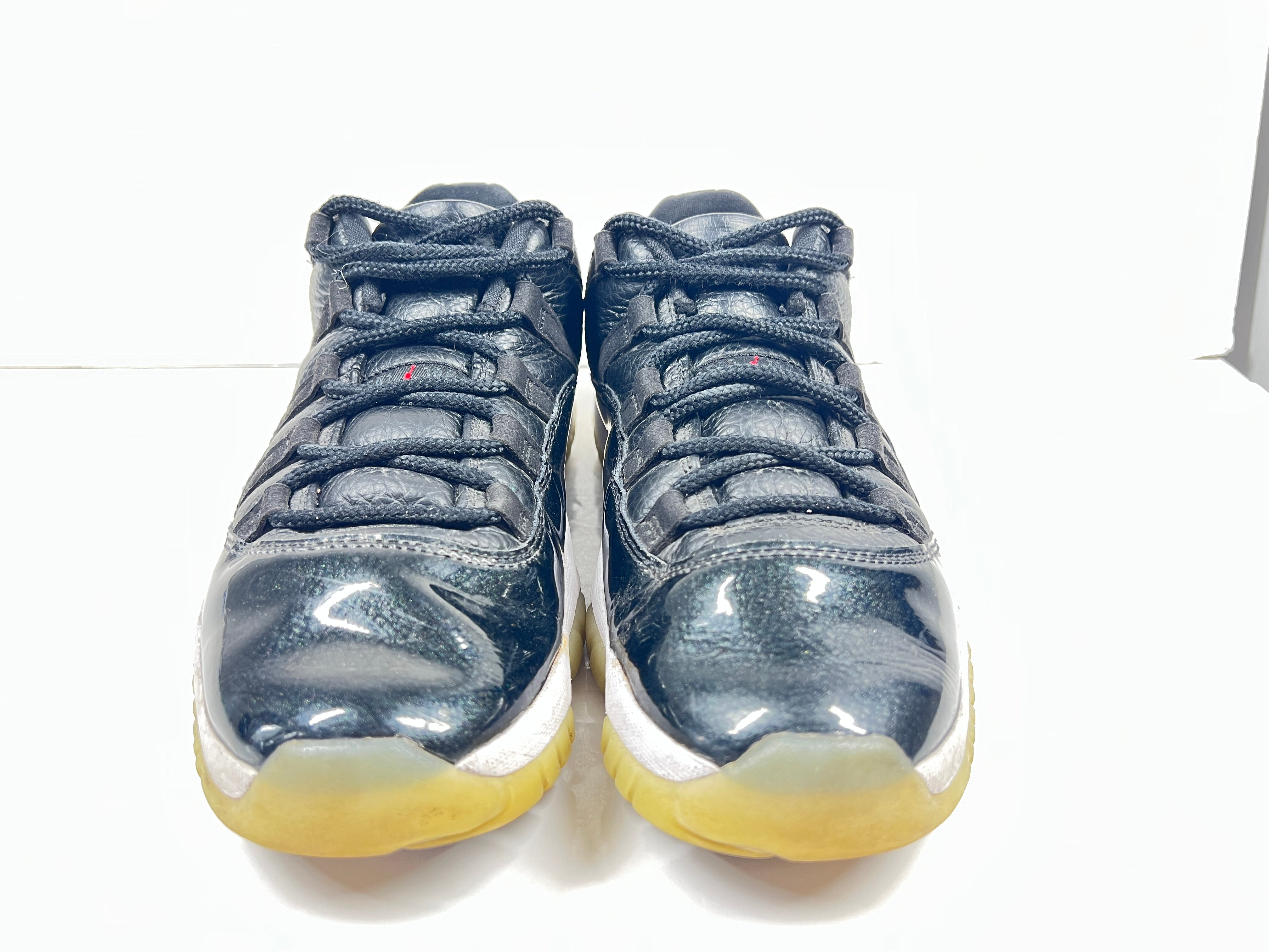 A pair of black Nike Air Jordan Retro 11 Low AV2187-001 sneakers.