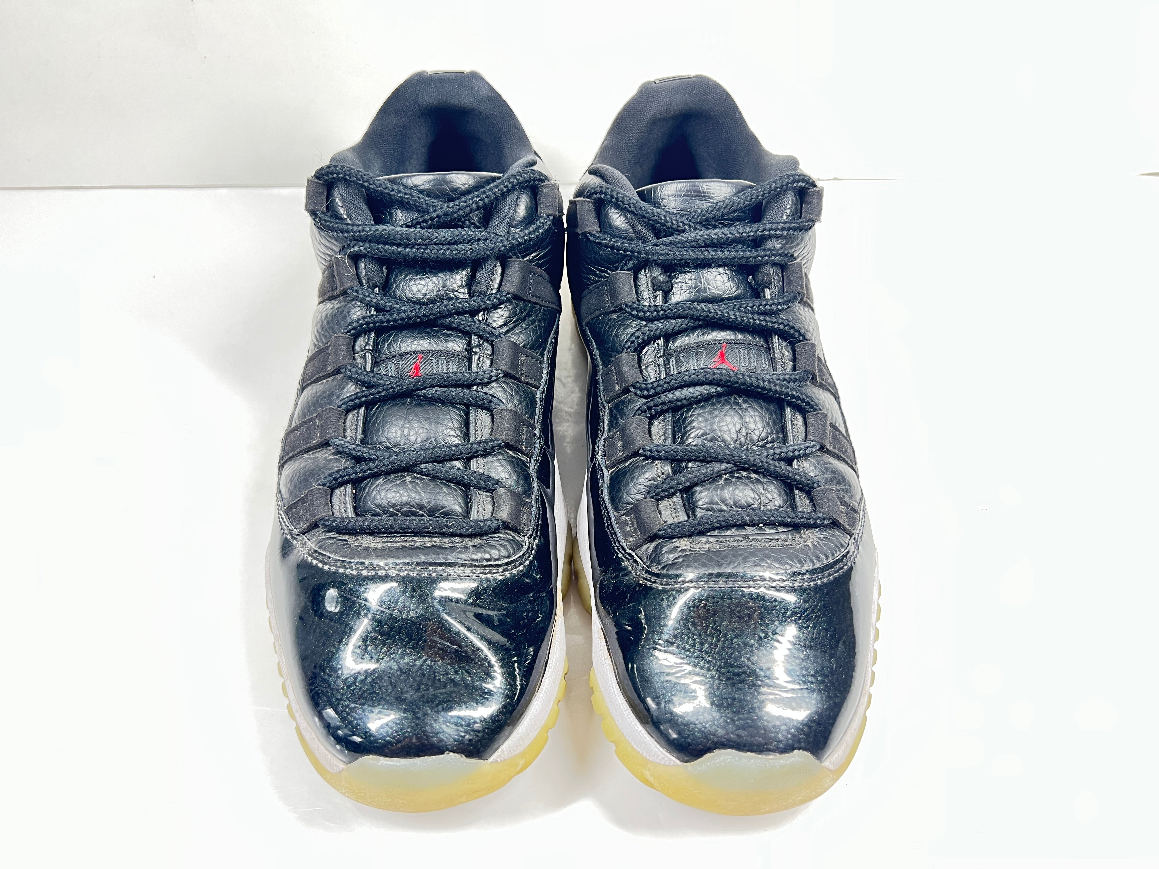 A pair of black Nike Air Jordan Retro 11 Low AV2187-001 sneakers.