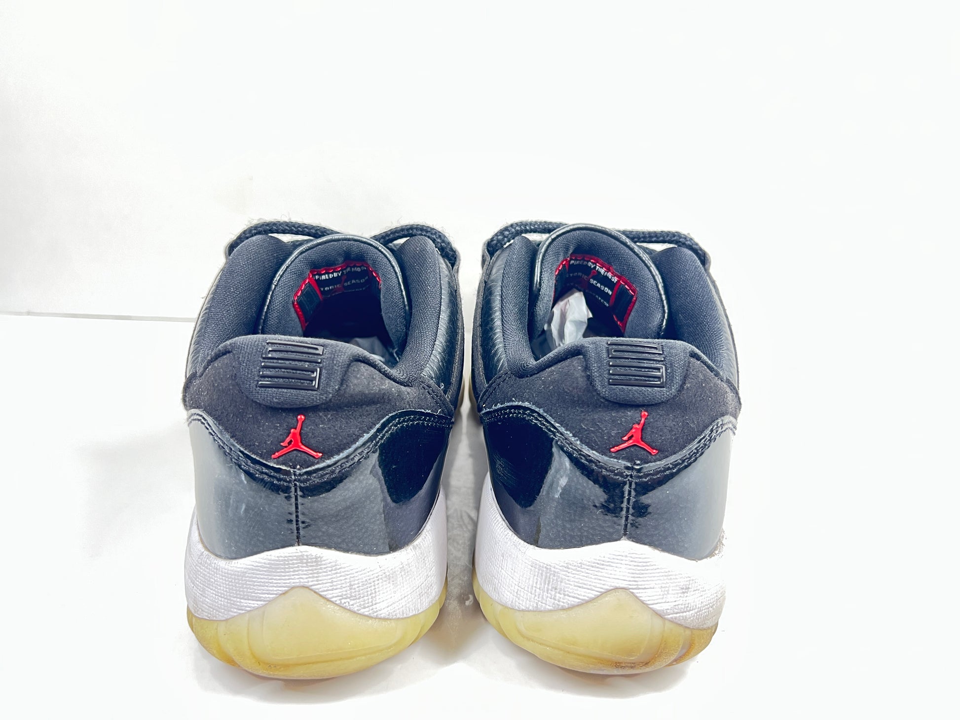 A pair of black Nike Air Jordan Retro 11 Low AV2187-001 sneakers.