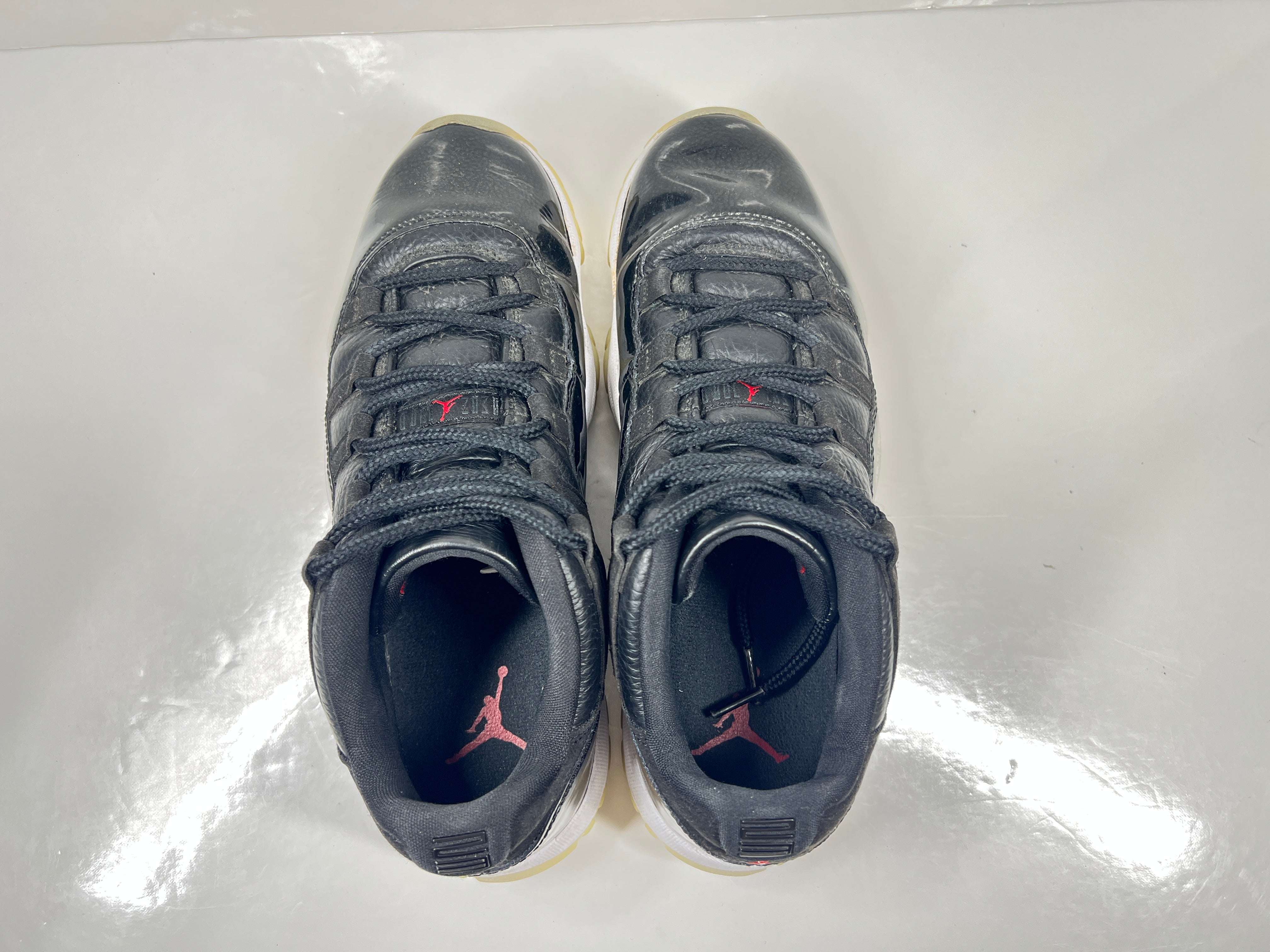 A pair of black Nike Air Jordan Retro 11 Low AV2187-001 sneakers.