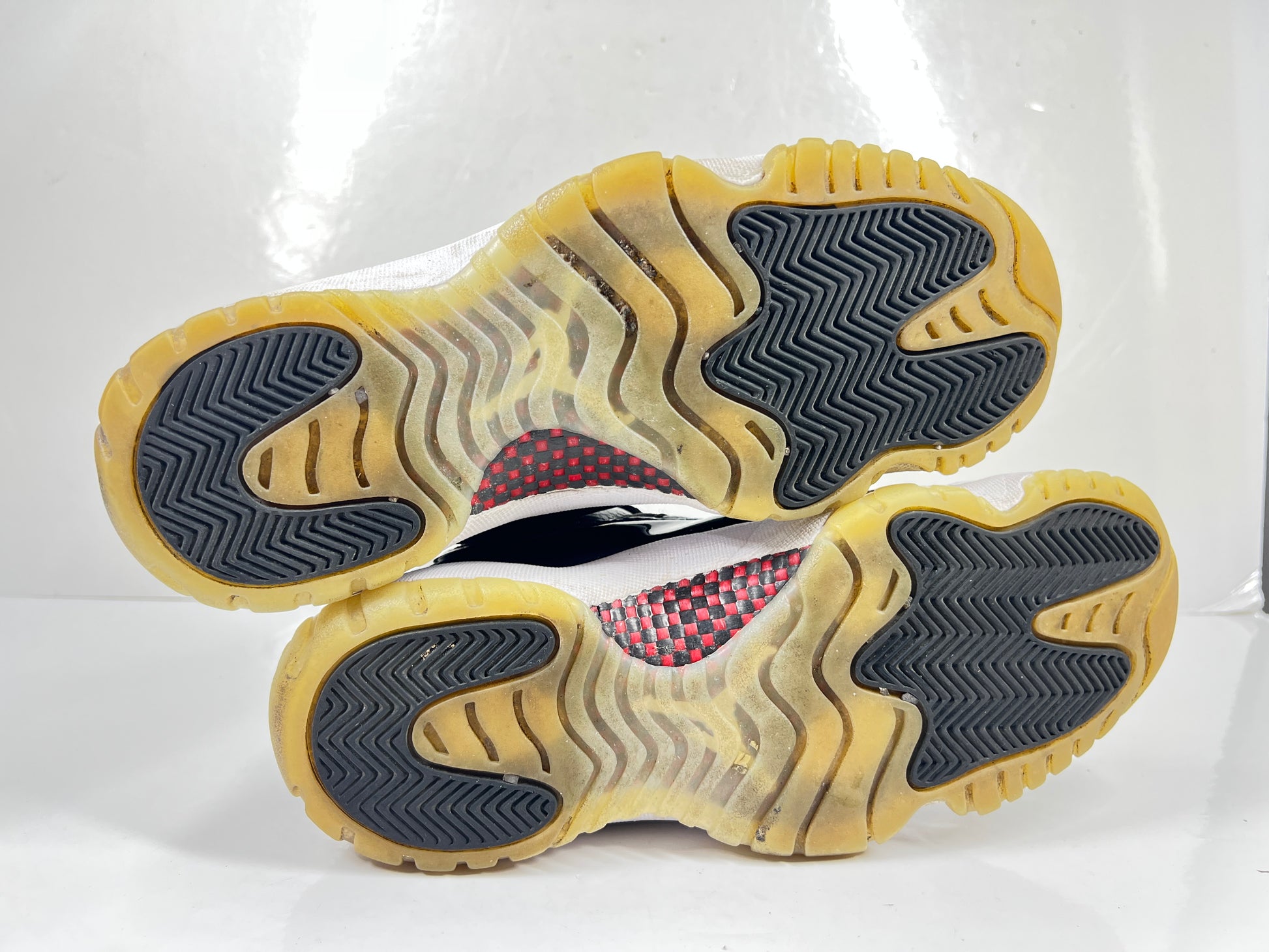 A pair of black Nike Air Jordan Retro 11 Low AV2187-001 sneakers.