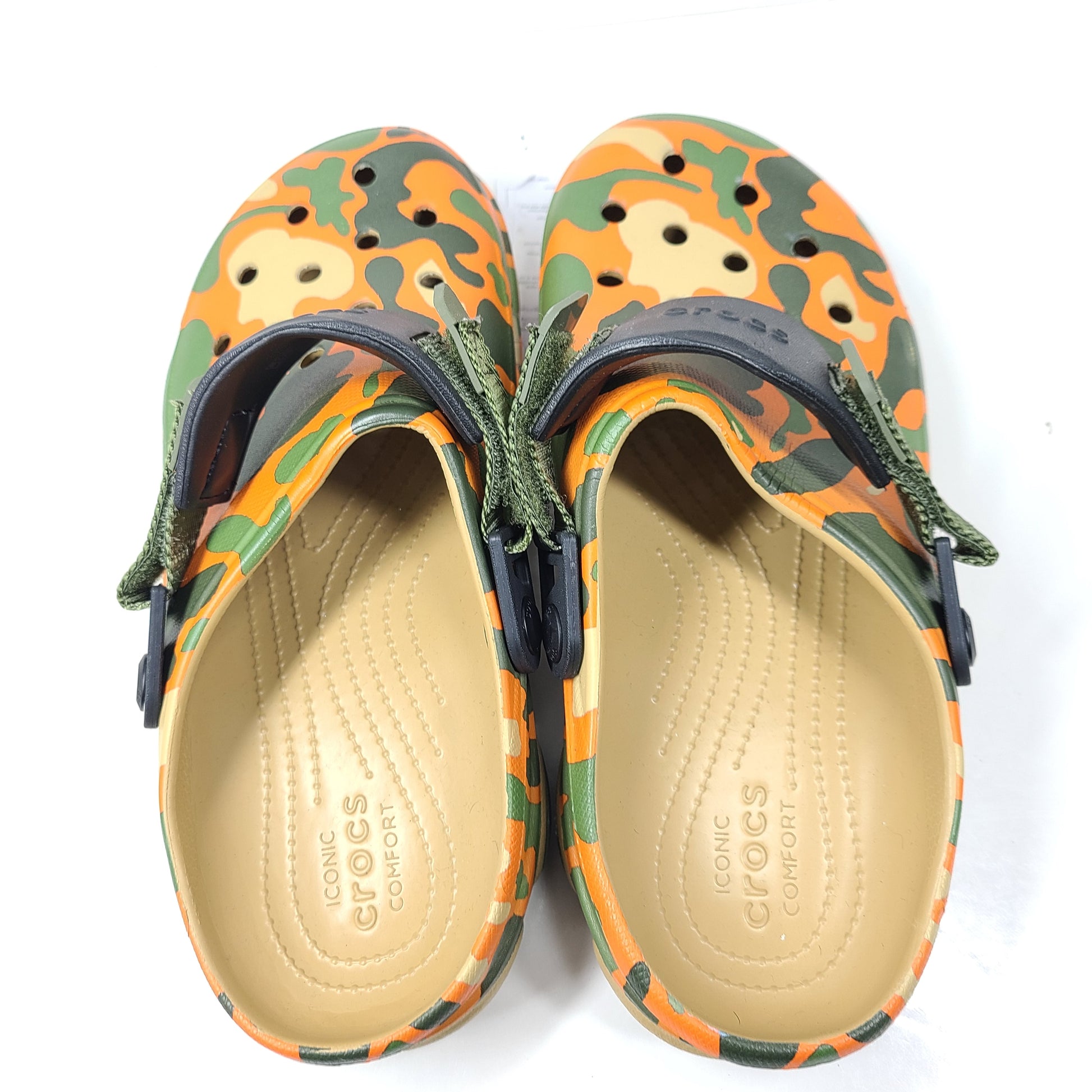 A pair of camouflage Crocs Classic clogs for men and women.