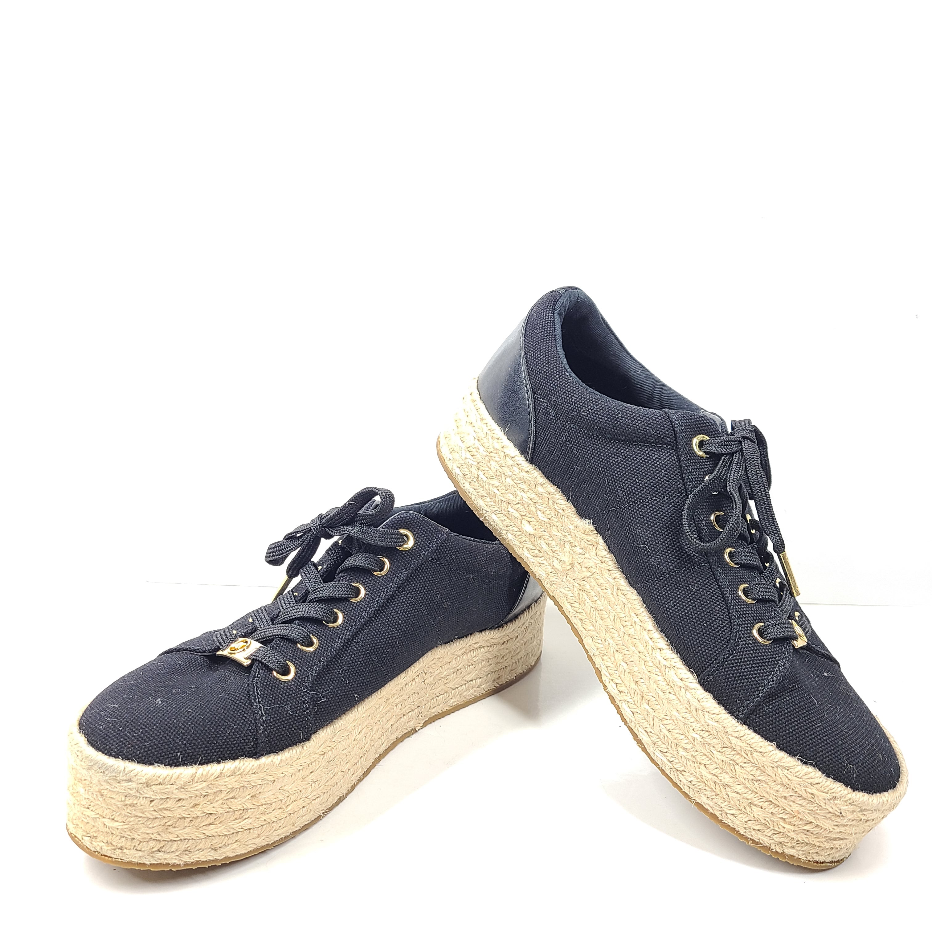 A pair of Michael Kors Women's Platform Sneakers in Black and Gold