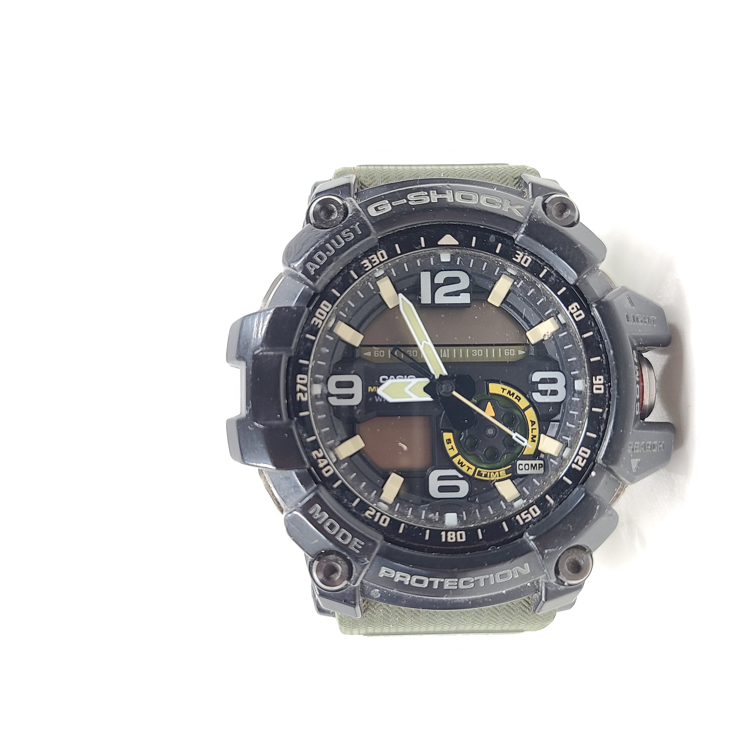 A military green Casio G-Shock watch on a strap.