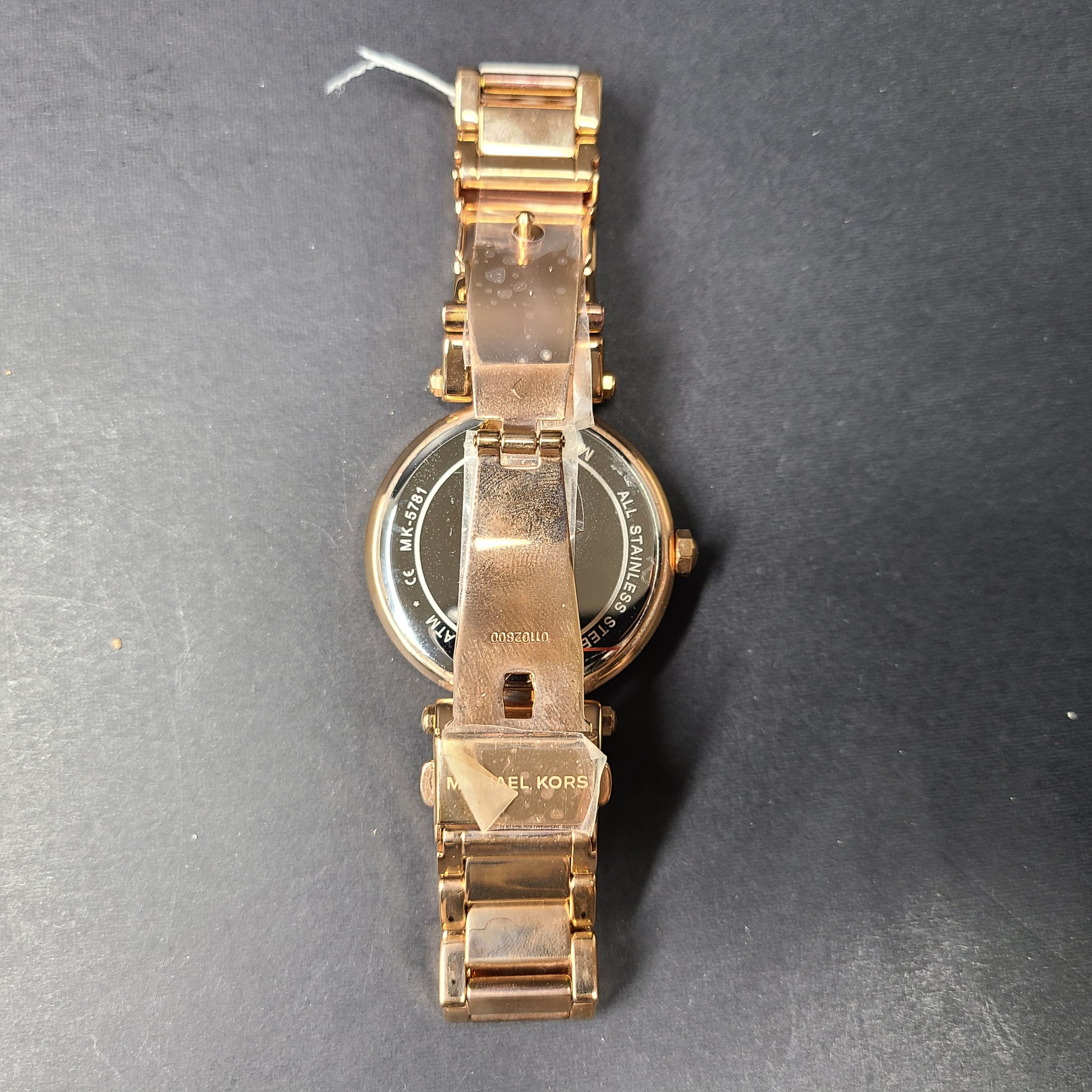A stylish Michael Kors women's rose gold watch with stainless steel strap.
