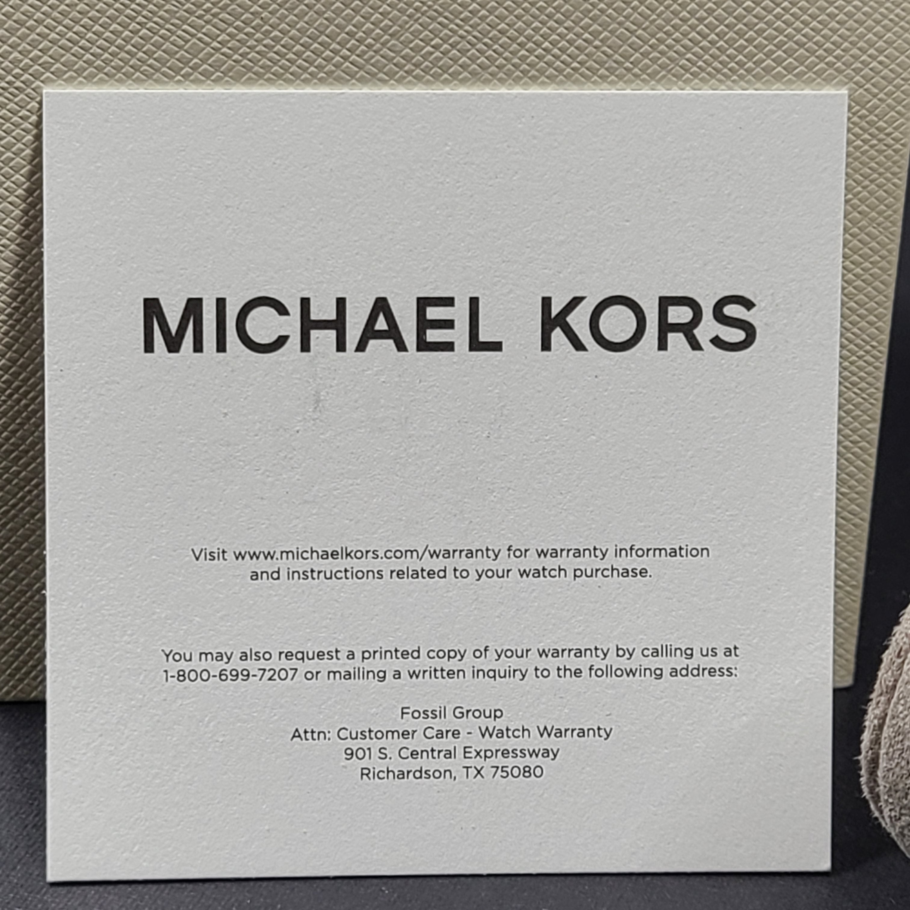 A stylish Michael Kors women's rose gold watch with stainless steel strap.