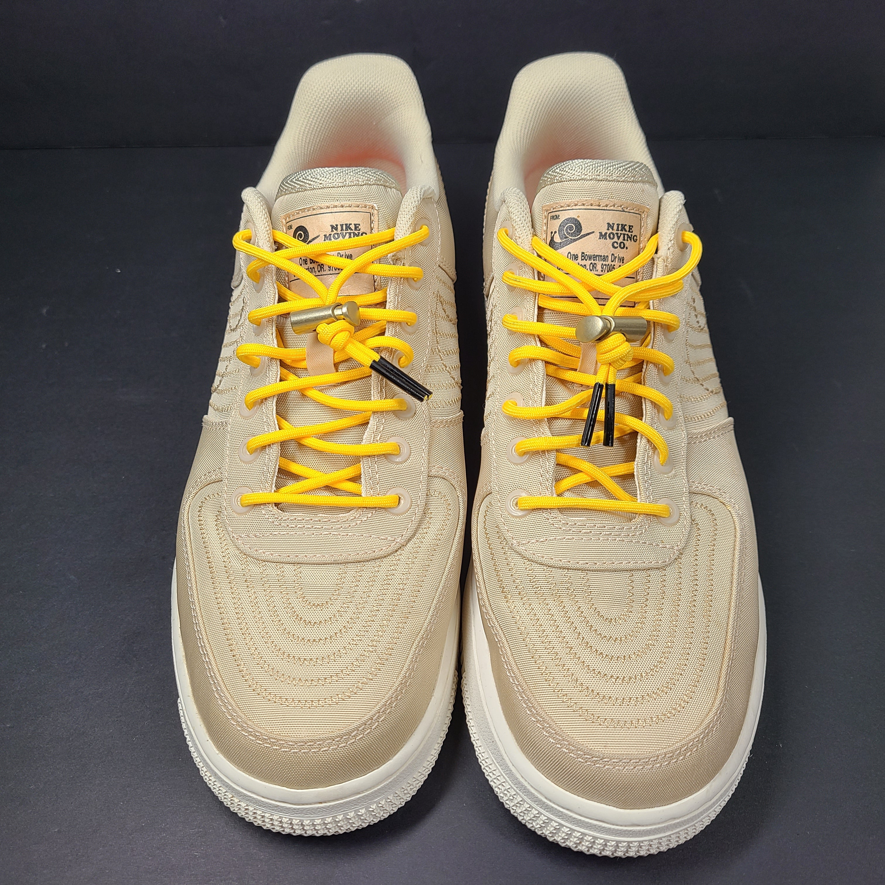 A pair of men's Nike Air Force 1 Low Beige sneakers.