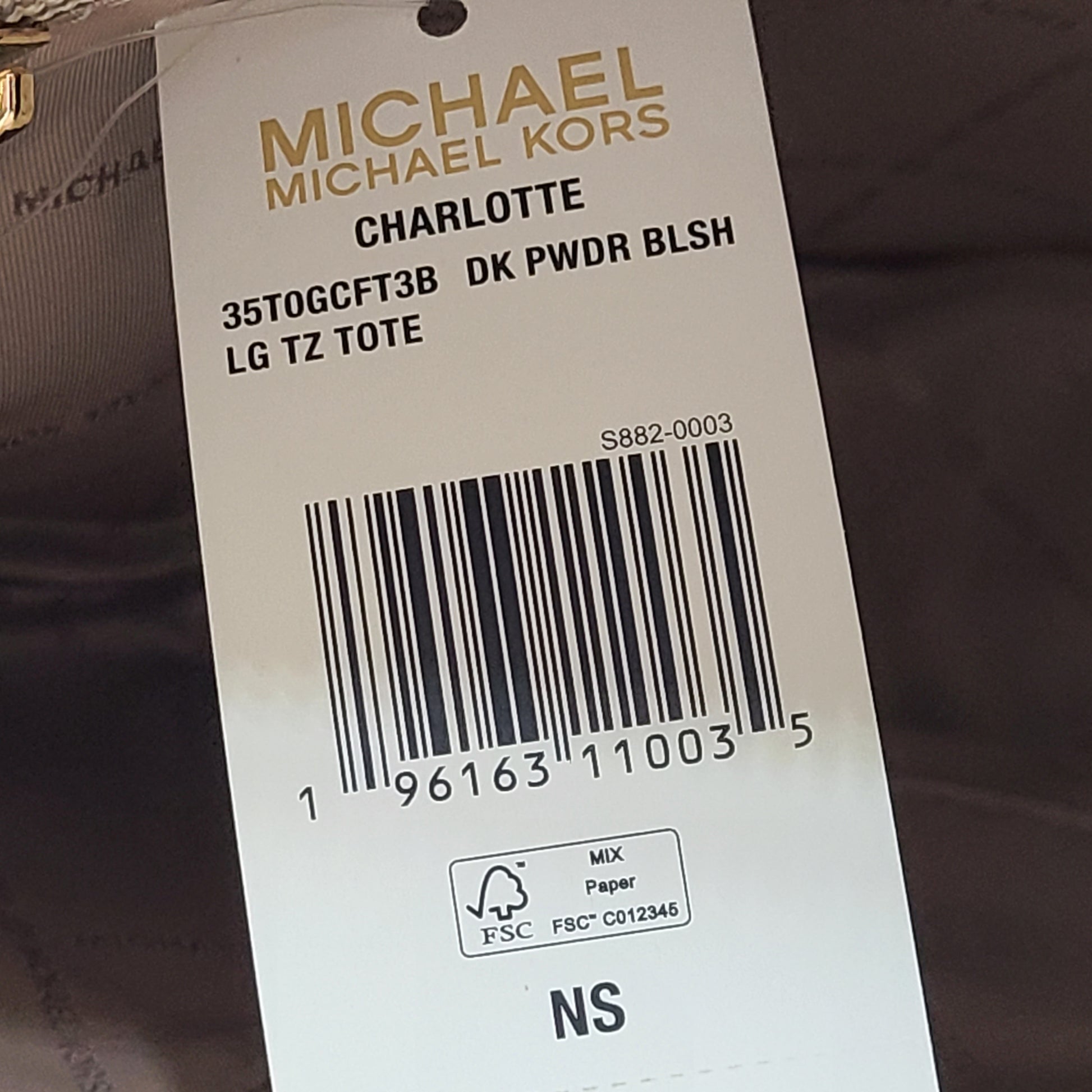 Light pink and logo canvas Michael Kors tote bag with gold zip and side pockets, shown with handles