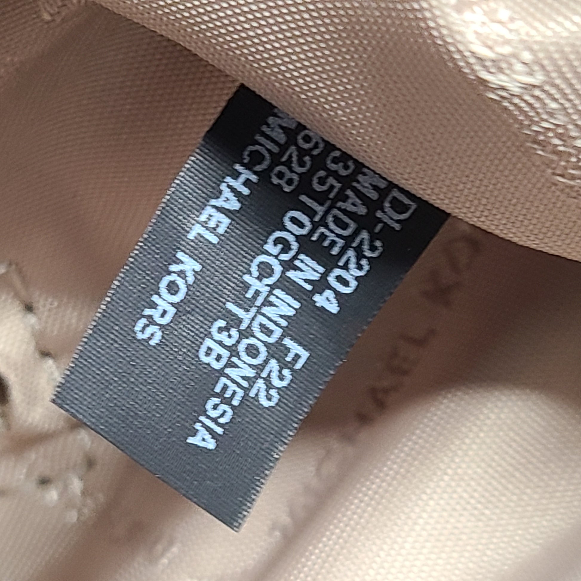 Light pink and logo canvas Michael Kors tote bag with gold zip and side pockets, shown with handles